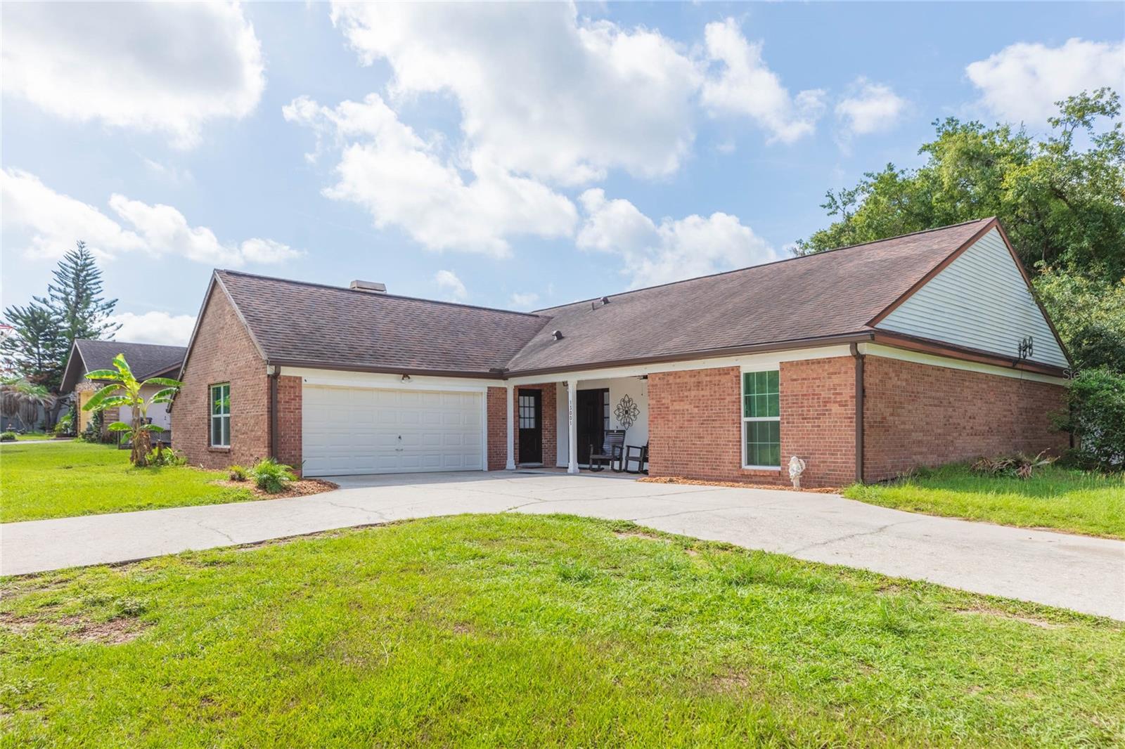 Location! Location! This beautifully updated 3-bedroom, 2.5-bath home with a versatile bonus room offers the perfect blend of modern upgrades and peaceful country living. Major improvements include a new roof (2020), new A/C (2024), new doors and windows (2020) and new gutters (2025), providing peace of mind for years to come. Inside, you'll find an updated kitchen featuring a center island, ideal for cooking and gathering. The spacious living area is anchored by a cozy wood-burning fireplace, while ceramic tile and wood-look tile flooring run throughout the home—NO carpet anywhere! The converted garage serves as a flexible bonus room, perfect for a home office, playroom, gym, or guest space. Situated on over half an acre, this property offers plenty of room to enjoy the outdoors with NO HOA restrictions. The fully fenced backyard is designed for entertaining and relaxation, featuring an 12' x 25' screened lanai, fire pit, swingset, and an abundance of fruit trees including banana, avocado, lemon, and olive trees. Need extra storage or workspace? The 12' x 25' barn with electricity is perfect for a workshop, hobby space, or additional storage. Additional features include a private well and septic system, as well as a water softener for added convenience. If you're looking for a move-in-ready home with major updates, flexible living space, and plenty of room to spread out both inside and out, this property is one you won't want to miss!