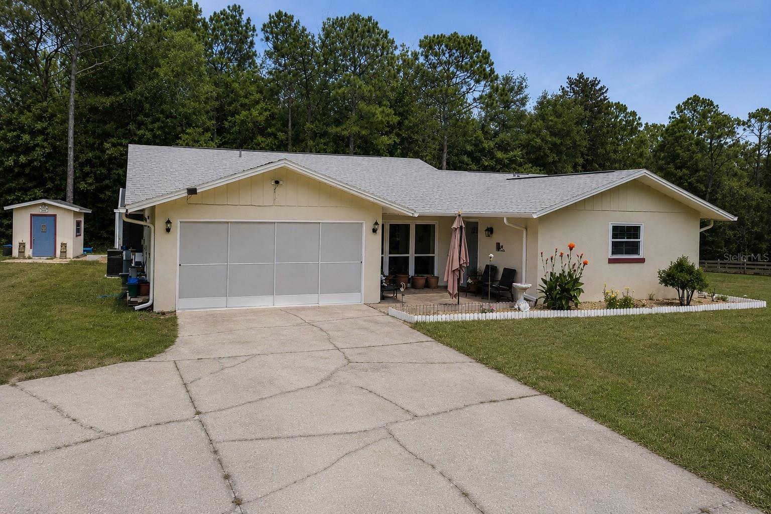 Home has a brand New Roof one month old AC replaced 4/2025. Nestled on 1.21 acres in the desirable Rainbow Springs area, this beautifully maintained 2 bedroom, 2 bath home offers the perfect blend of privacy, comfort, and energy efficiency. With 1,747 square feet of living space, the home features a thoughtful layout designed for both everyday living and entertaining. The property has seen numerous valuable upgrades, providing peace of mind for the next owner. Recent improvements include a new pool liner installed January 2025, a new A/C system added April 2025, a new water softener, and a new garage door. One of the standout features is the 32 solar panels, dramatically reducing monthly electric costs with an average electric bill of approximately $45 even during peak usage months. This makes the home not only comfortable but exceptionally economical to operate. Thirteen windows were replaced in 2017, allowing for abundant natural light while improving energy efficiency throughout the home. Step outside and enjoy the expansive outdoor space, offering endless possibilities for relaxing, gardening, or creating your own private retreat. The generous acreage provides room to spread out while still being conveniently located near the natural beauty, springs, and recreation that make Rainbow Springs so sought after. Property also has 2 sheds. This property is an excellent opportunity to own a move in ready home with major upgrades already completed, set on a spacious lot in one of the area’s most desirable communities.