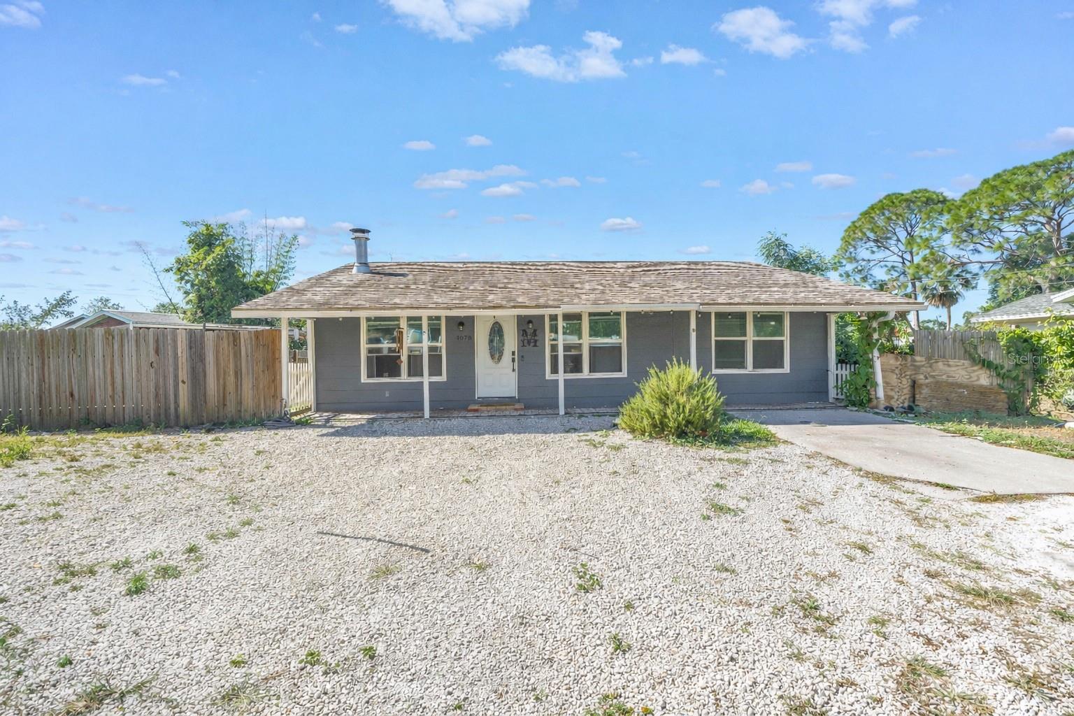 ***ASSUMABLE FHA MORTGAGE AVAILABLE AT 2.9%*** In a city where home prices often feel out of reach, this well-maintained three-bedroom, one-bath residence offers something increasingly rare: a real opportunity to plant roots in Sarasota without sacrificing location or potential. Set on a quiet, non-HOA neighborhood just minutes from the beach, downtown, shopping, and restaurants, this home proves that owning in Sarasota does not mean choosing between charm, location, and affordability. Inside, you will find an open layout with tile and laminate flooring, natural light throughout, and a warm, welcoming feel ready to be personalized. The kitchen has been thoughtfully updated with granite countertops and refreshed cabinetry that seamlessly blends function and simplicity, while unifying the living and dining areas. A cozy brick fireplace, featuring an above-mantel TV mount, anchors the living room, making it perfect for both quiet evenings with a book and hosting game day with friends. The primary bedroom features two closets and a dual-access ensuite bath that connects to the hallway leading to the home's two additional bedrooms. Step outside to a fully fenced backyard with a spacious deck, fire pit, and a large permitted shed that offers flexibility for storage or creative use, along with ample room for a home addition or pool, if desired. While it is not the biggest or flashiest house in town, it is real, it is ready, and it can be yours to shape. Whether you are a first-time buyer looking to stay in Sarasota on a budget, a seasonal visitor in need of a winter retreat, or someone who values authenticity, this is a home where you can begin to build not just equity, but a meaningful life. QUALIFIED BUYERS MAY HAVE THE OPPORTUNITY TO ASSUME THE EXISTING FHA LOAN AT A 2.9% INTEREST RATE. THIS RARE FINANCING OPTION COULD MEAN SIGNIFICANT MONTHLY SAVINGS COMPARED TO CURRENT MARKET RATES. ASSUMPTION IS SUBJECT TO LENDER APPROVAL AND BUYER QUALIFICATION. CONTACT THE LISTING AGENT FOR DETAILS.