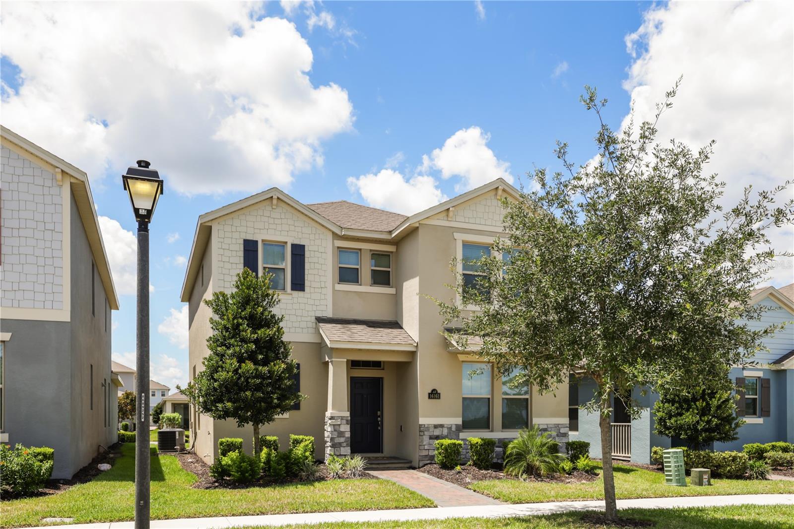 Welcome to 16161 Mangrove Road, where modern elegance meets resort-style living in the award-winning Waterleigh community! This beautifully maintained 3-bedroom, 2.5-bath home offers the perfect combination of timeless design, spacious living, and an unbeatable location in the heart of Winter Garden. Step inside to discover an inviting open-concept floor plan filled with natural light, soaring ceilings, and stylish tile flooring throughout the main level. The spacious living and dining areas seamlessly flow into the stunning gourmet kitchen, featuring quartz countertops, an oversized center island, stainless steel appliances, abundant shaker cabinetry, a walk-in pantry, and plenty of prep space perfect for entertaining or everyday living. Upstairs, the master bedroom offers plenty of space and includes an oversized walk-in closet, and a spa-inspired ensuite with dual vanities and quartz countertops. Two generously sized secondary bedrooms share a full bath, while the upstairs loft provides the perfect flex space for a playroom, home office, or media area. Step outside to your covered brick-paver lanai, creating the ideal space for morning coffee, weekend barbecues, or relaxing with friends year-round.
Living in Waterleigh means enjoying one of Central Florida's most sought-after master-planned communities. Residents enjoy resort-style pools, an elegant clubhouse, tennis courts, playgrounds, fitness centers, scenic walking trails, dog parks, picnic areas, and beautifully maintained green spaces. Community pool, mailbox, and playground is just a few steps away from the house making life even more enjoyable and convenient.  You will also love the ability to walk to top-rated A+ schools located right within the neighborhood the elementary school is just a few blocks away and the middle school is the highest ranking middle school in the district for Orange County. Ideally located in Horizon West, you'll also be just minutes from Hamlin Town Center, Flamingo Crossings, Walt Disney World, shopping, dining, major highways, and everything Central Florida has to offer. Whether you're looking for your first home, your forever home, or simply a place where every day feels like a vacation, this home and community delivers the lifestyle you've been waiting for.  Schedule your private showing today and experience all that Waterleigh has to offer!