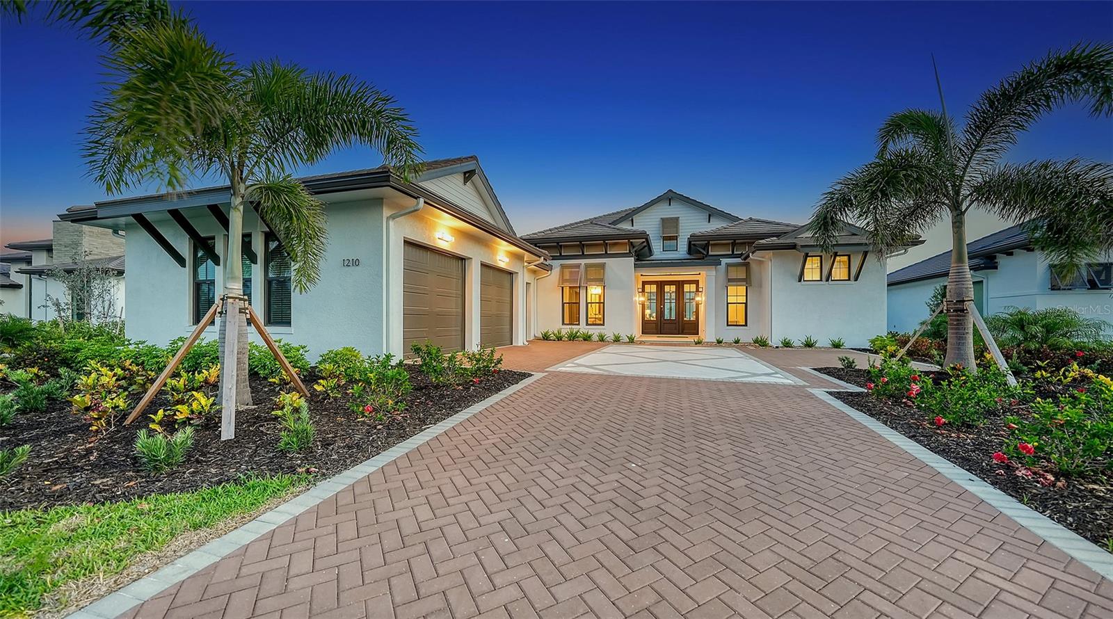 Available now! Best Overall Home Winner in the 2024 Parade of Homes! Elevate your lifestyle with coastal contemporary luxury in this professionally designed fully-furnished model home, ideally positioned on a south-facing premium lakefront homesite in Wild Blue, Lakewood Ranch’s newest luxury enclave. Crafted with impeccable attention to detail and the highest level of craftsmanship, the Taura model by Arthur Rutenberg Homes features hurricane-rated impact windows and doors, complemented by exquisitely curated finishes that enhance every space. Inside, sophisticated wall and ceiling details set the tone, while a well-appointed custom entertaining bar adds functionality and flair. The state-of-the-art kitchen, equipped with built-in Thermador appliances, is accompanied by a thoughtfully designed prep pantry featuring an additional full refrigerator, sink, and abundant shelving and cabinetry. A versatile flex room provides adaptability to suit your needs, while the primary suite serves as a serene retreat, with 10 ft. sliders opening to a lanai where an inviting fireplace creates a cozy setting for Florida’s cooler evenings. Enhancing the indoor-outdoor flow, the dining room connects seamlessly to the outdoors through disappearing corner sliding doors, unveiling a stunning oasis complete with a full kitchen, chic entertaining areas, a saltwater pool and spa, and breathtaking long lake views. This exceptional home embodies luxury and refinement, offering an unparalleled lifestyle in a premier neighborhood. List price includes furniture, decor, artwork, rugs, window treatments, TVs, and electronics.