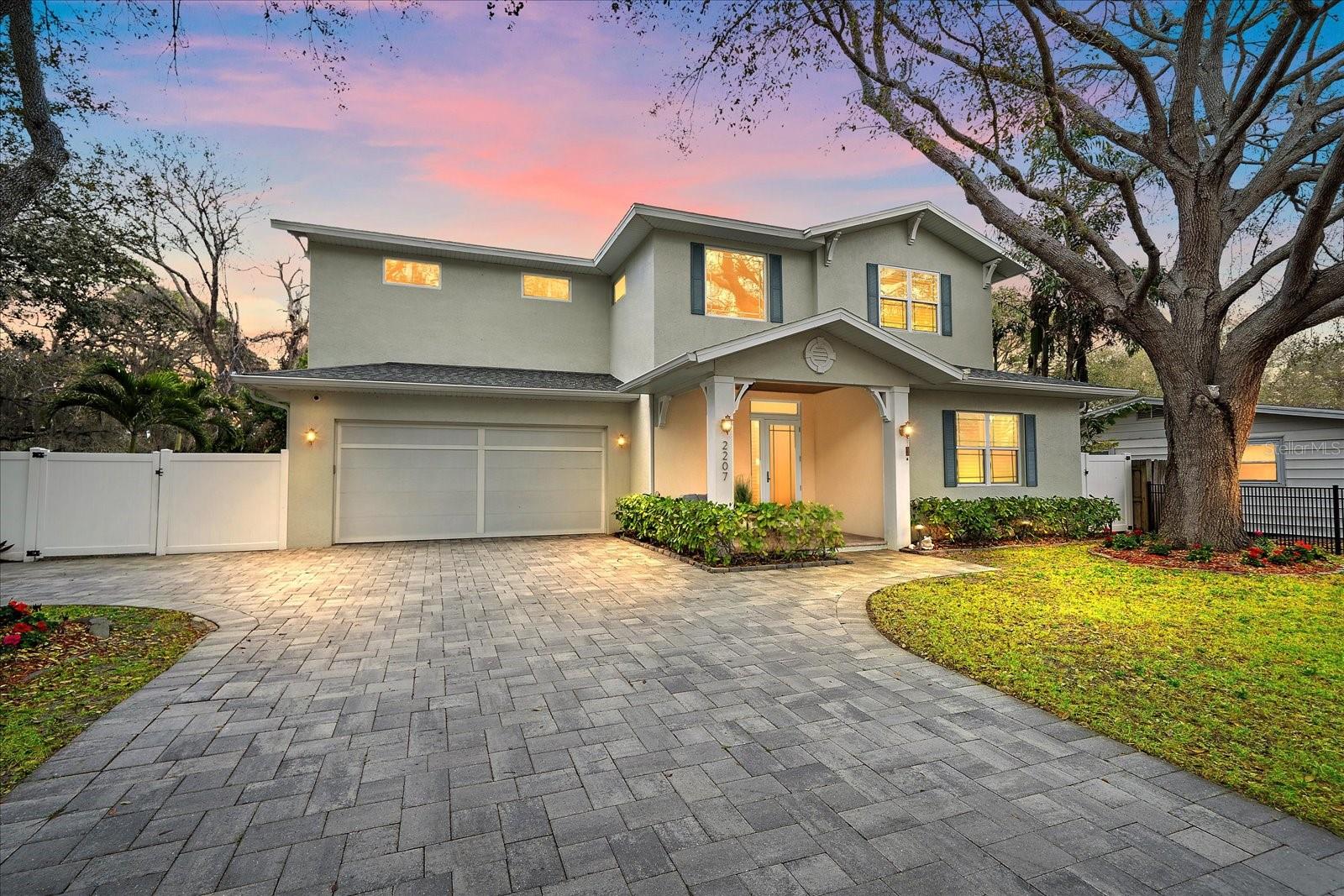 Virtually Staged. East of the Trail in Sarasota, this 2017-built concrete block pool home offers 4 bedrooms, 4 bathrooms, and a rare double-primary layout on an oversized gated and fully fenced lot just minutes from Siesta Key Beach, downtown Sarasota, Arlington Park, and Southside Village. Combining newer construction, Flood Zone X positioning, and a highly desirable central Sarasota location, this home delivers the features buyers are actively searching for today. Designed for both everyday living and entertaining, the open-concept floor plan features high ceilings, abundant natural light, and seamless indoor-outdoor flow. A three-panel sliding glass door connects the main living area to the covered lanai and screened pool, creating a true Sarasota indoor-outdoor lifestyle. A modern electric fireplace anchors the living space, while automatic entry blinds add convenience and privacy with additional plantation shutters throughout. The kitchen is built for functionality and gathering, complete with quartz countertops, a gas range, stainless steel appliances, slow close cabinetry, a large center island, and newly updated refrigerator, microwave, and wine refrigerator in 2025. The first-floor primary suite includes two walk-in closets and a spacious bath with marble flooring, soaking tub, walk-in shower, and dual vanities. A first-floor laundry room adds daily convenience. Upstairs, engineered hardwood flooring extends throughout, leading to a large bonus room ideal for a home office, media room, or fitness space. Two secondary bedrooms share a bath on one side, while a separate second primary suite with ensuite bath and walk-in closet offers privacy for guests, multigenerational living, or flexible use. Outdoor living is designed for real use, with a screened pool, covered lanai, outdoor kitchen, paver deck, and fenced yard with usable green space. Additional features include hurricane impact windows and doors, spray foam insulation, gas tankless water heater, and an epoxy-coated garage floor. Located within Sarasota city limits with close proximity to beaches, dining, shopping, and I-75, this home offers a compelling combination of location, construction quality, and flexible living. Potential short-term rental opportunities may be available, subject to city regulations and buyer verification.