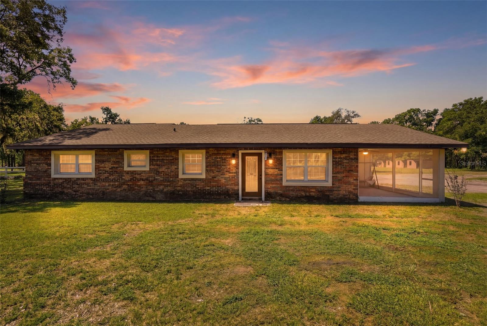 NEW! Price correction, and seller now offering $10,000 toward buyer's closing costs or a rate buydown with an acceptable offer. Completely renovated 3-bedroom, 2-bath block home on 1.92 private, level acres with no HOA or CDD. Offering over 2,000 square feet, a bright open kitchen, beautifully updated baths, a large screened porch, RV and boat parking, and room to garden, play and enjoy a peaceful country lifestyle—all within easy reach of shopping, dining and the Suncoast Parkway. NO HOA and NO CDD fees! Recent renovations in 2021 and improvements include the roof, electrical, septic system, well tank, water heater, and HVAC. A whole-house water softener was installed approximately six months ago. Enjoy the convenience of an integrated smart home system with built-in speakers throughout the home and screened lanai, allowing you to control lighting, audio, televisions, and security cameras from your smartphone or the central control panel. TVs and smart home equipment are included! Crown molding, tray ceilings, quartz countertops, beautifully tiled showers, and marble tile flooring throughout add timeless style and quality to the home's interior. Zoned Agricultural-Residential (A-R), this property is ideal for those seeking space, privacy, and a rural lifestyle. Bring your horses, chickens, and other livestock for personal use, create your own garden, or enjoy a hobby farm. The AR zoning offers added flexibility, including the potential for an Accessory Dwelling Unit (ADU), subject to county approval and applicable regulations. A storage shed is included, and the usable acreage offers endless possibilities for recreation, pets, gardening, and future expansion, all just minutes from shopping, dining, schools, medical facilities, the Suncoast Parkway, Weeki Wachee Springs, Gulf Coast beaches, and an easy commute to Tampa.