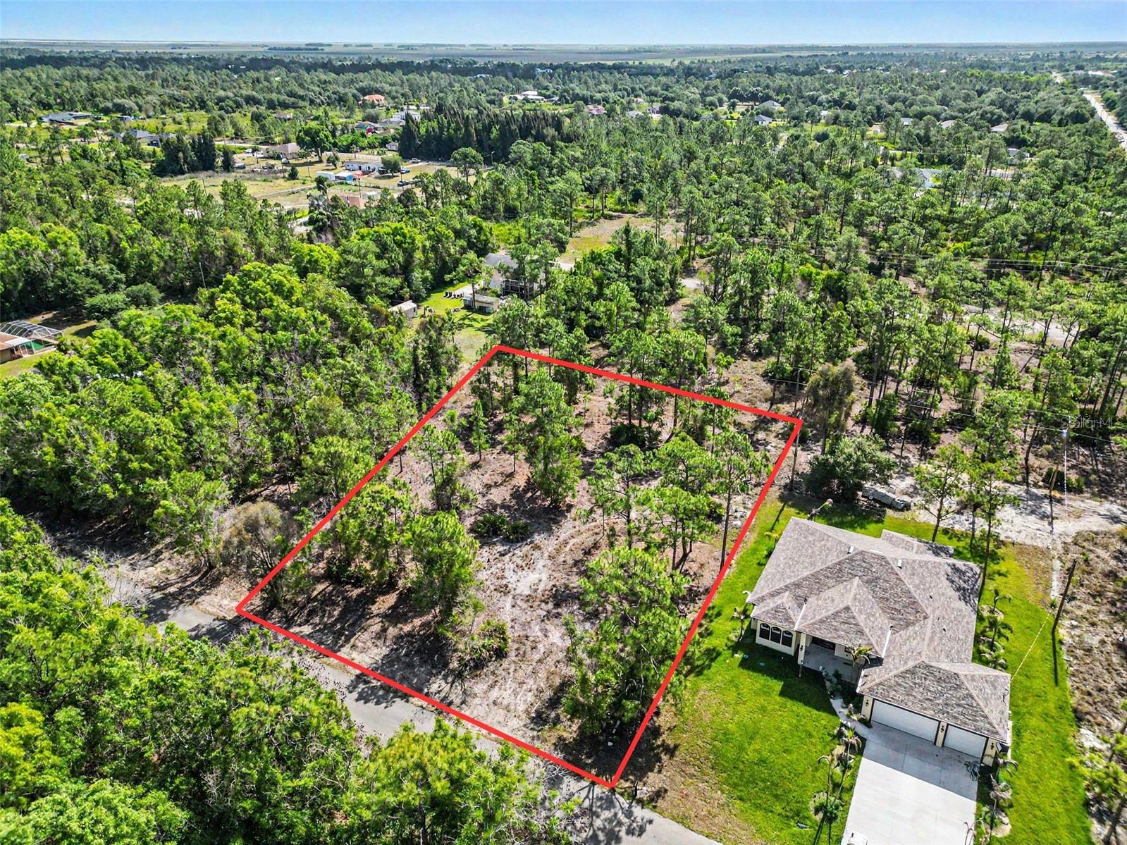 Build your dream home on this spacious .5-acre vacant lot located in the growing community of Lehigh Acres. Offering ample space and flexibility, this property provides the perfect opportunity to design a custom residence tailored to your lifestyle, whether you envision a modern estate, a private retreat, or a long-term investment. Surrounded by natural Florida beauty, this homesite is ideally positioned near an abundance of outdoor recreation, including nearby nature parks, walking trails, and preserves that showcase the area’s peaceful, laid-back atmosphere. For golf enthusiasts, multiple courses are just a short drive away, offering year-round enjoyment in the Southwest Florida sunshine. With its generous size and desirable location, this lot combines privacy with convenience—close enough to shopping, dining, and everyday essentials, yet tucked away in a serene setting. Whether you’re ready to build now or secure land for the future, this .5-acre parcel is a fantastic opportunity in a rapidly developing area.