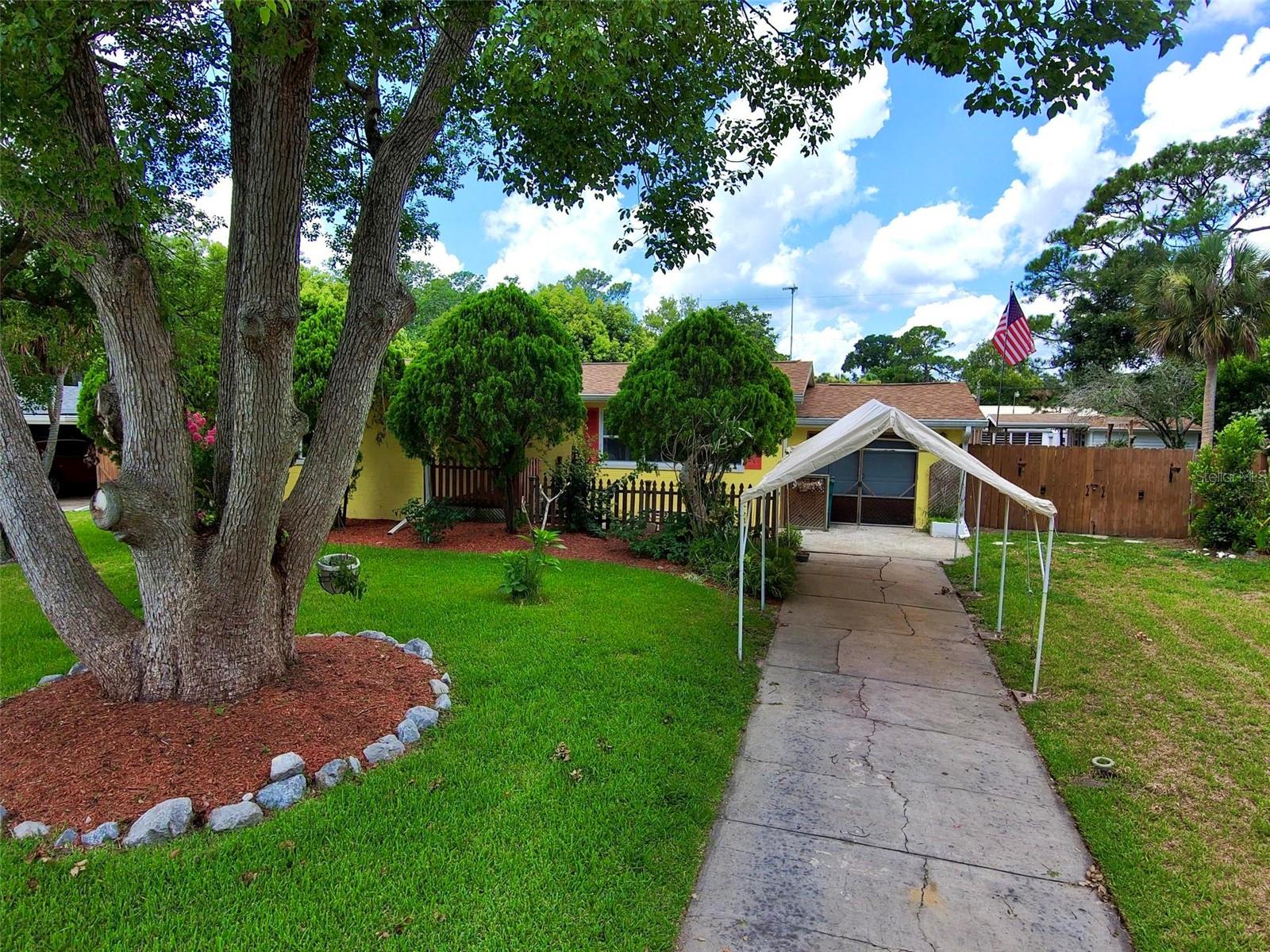 Nestled beneath beautiful, mature oak trees, this inviting home features hardwood flooring that adds warmth and character throughout. The beautifully landscaped yard creates a peaceful setting, while the spacious backyard offers a pool, deck, and fire pit—perfect for relaxing, entertaining family and friends, or enjoying Florida's year-round sunshine. Also, includes space and hook up for your RV.

Ideally located just a short stroll from the Intracoastal Waterway, this home is also conveniently close to shopping, dining, and the nearby Riviera Golf Club, giving you easy access to everything you need while enjoying a quiet neighborhood atmosphere.

Whether you're searching for your next home or an outstanding investment opportunity, this property offers incredible value.  Priced to sell quickly and is an exceptional opportunity in today's market.

Don't miss your chance to own this charming Holly Hill gem. Schedule your private showing today before this special property is gone!