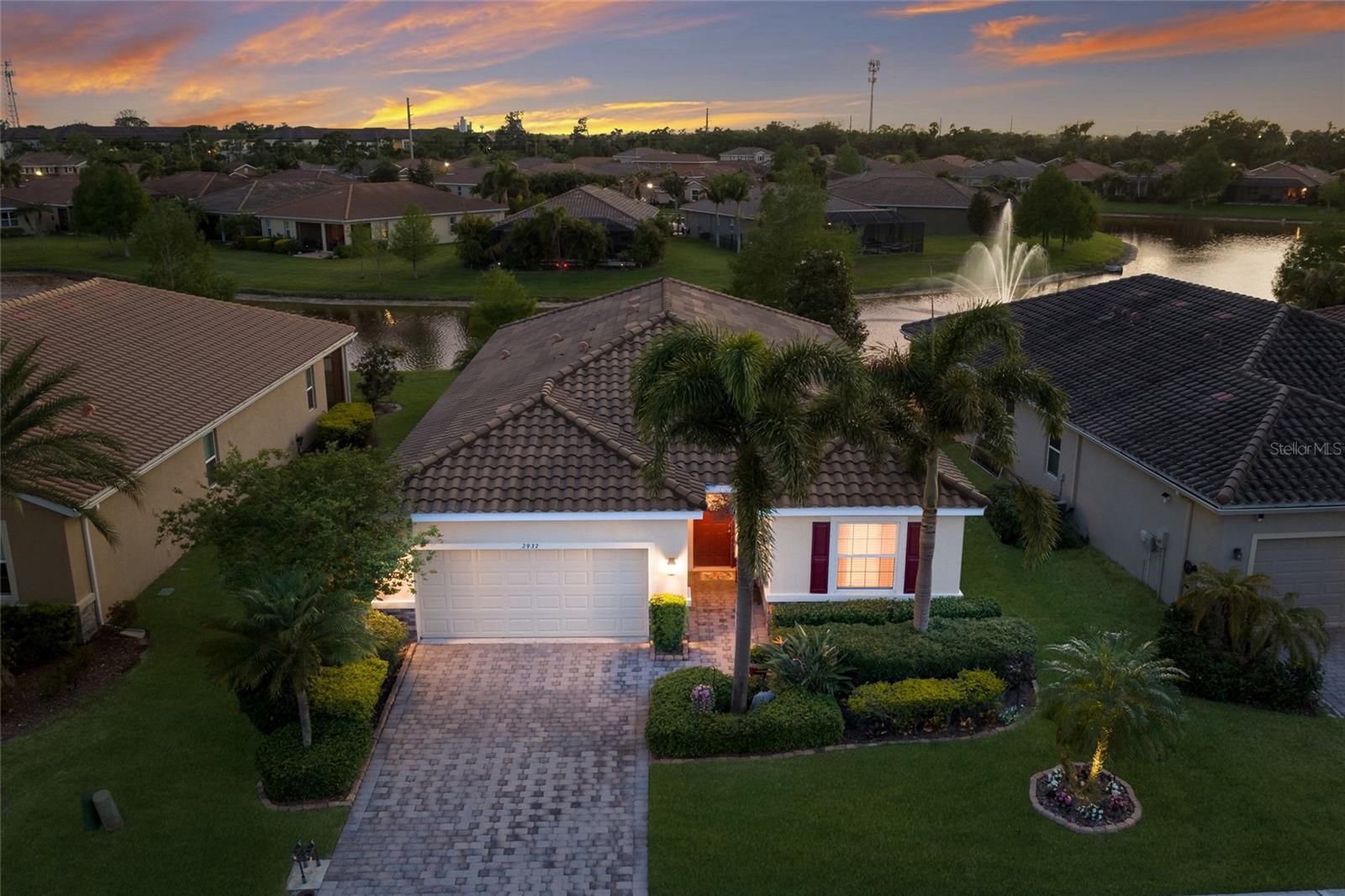 WELCOME to your slice of paradise in the sought after GATED community of Soleil West!!! This beautifully maintained one-story home offers 3 bedrooms, 2.5 baths, a 2-car garage, and 2,036 sq. ft. of thoughtfully designed living space. From the moment you walk through the front door, you’re greeted by a long, inviting hallway featuring a guest bedroom and a full bath with a tub/shower combo and single vanity, making it perfect for visitors. Just beyond, step through ELEGANT FRENCH GLASS DOORS into a versatile den, ideal for a home office or formal dining room. Continue into the heart of the home where an open-concept kitchen and living room create the perfect space for entertaining and everyday living. The SPACIOUS kitchen boasts upgraded cabinetry, a TILED backsplash, stainless steel appliances, WALK-IN PANTRY and a large island with a dual sink and eat-in space. Adjacent to the kitchen, the dining area is perfectly positioned with a window overlooking the lanai. The living room offers a warm and relaxing atmosphere, complete with glass sliders that open to SERENE pond views. Tucked away for maximum privacy, the primary suite features a TRAY ceiling, UPGRADED carpet, and an ENSUITE bath with dual sinks, a walk-in tiled glass shower, and a separate soaking tub. An additional bedroom and a convenient half bath complete the layout. Step outside to your screened-in lanai and your own PRIVATE retreat where you can unwind while enjoying breathtaking sunsets over the peaceful POND and fountain. The home is beautifully landscaped and includes PREMIUM LUXURY VINYL WOOD flooring, upgraded ceiling fans throughout, added cabinetry in the laundry room for extra storage, and a new HVAC blower motor installed in 2023. Residents of Soleil West enjoy gated access and resort-style amenities including a clubhouse, pool, fitness center, and dog park, all in a PRIME location just off University Parkway. You’re minutes from The Mall at University Town Center, Nathan Benderson Park, Sarasota-Bradenton International Airport, fine dining, shopping, top-rated schools and the WORLD FAMOUS GULF BEACHES. This is truly the home you’ve been waiting for, offering comfort, style, and an unbeatable location. Don't wait to make this your home and begin your FLORIDA Lifestyle!