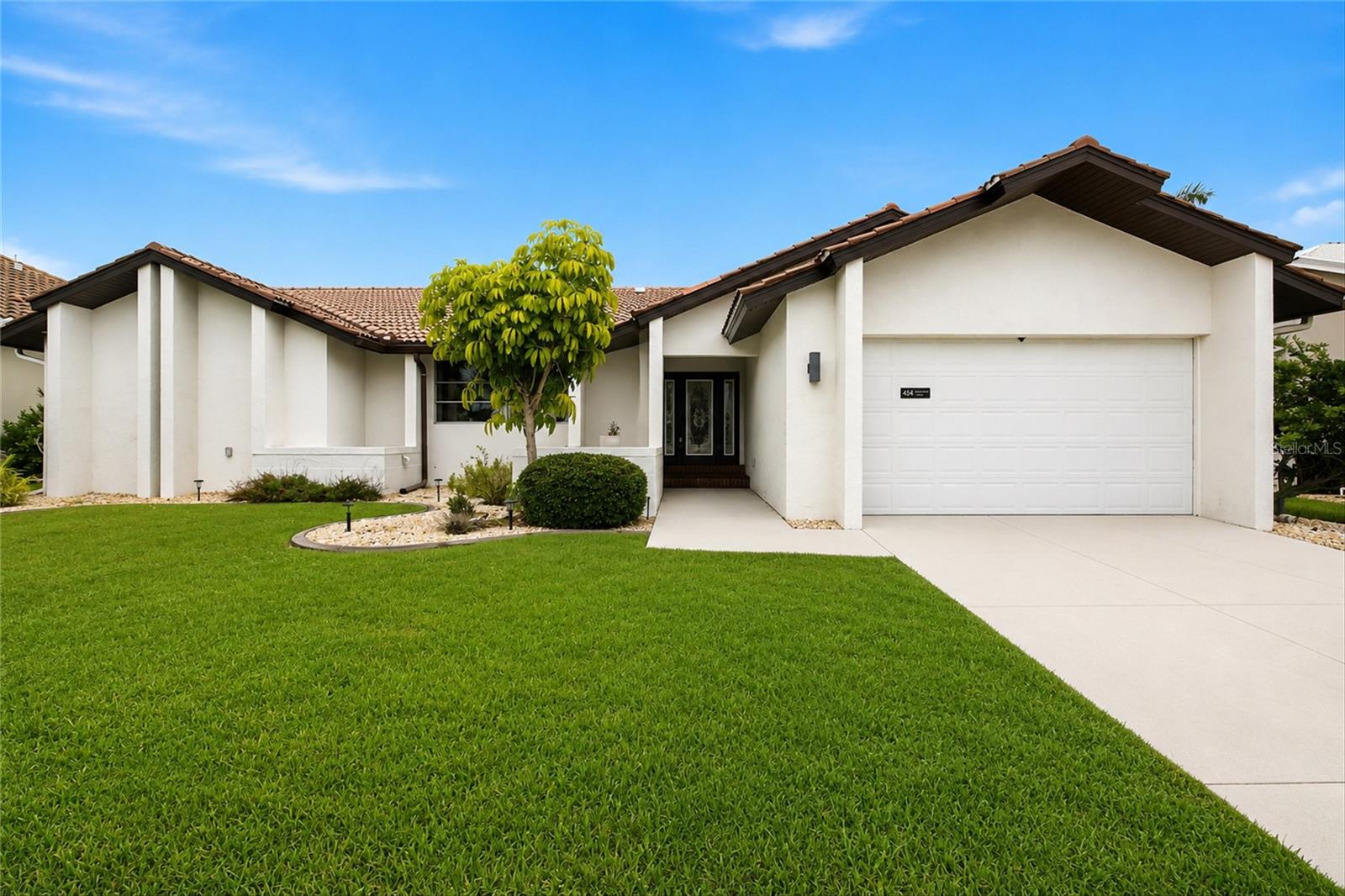 Move-in ready single-story waterfront-style home in desirable Punta Gorda Isles (Sec 15). Built in 1984, this well-maintained residence offers 3 bedrooms, 2 baths and 2,213 sq ft of heated living area (3,155 total sq ft) on a generous 9,601 sq ft (0.22 acre) lot with ample yard space and curb appeal. The spacious, functional floorplan features a split-bedroom layout for privacy, an open living room (approx. 19 x 18) and separate eating area, a kitchen (approx. 13 x 12) with breakfast bar, solid surface counters and solid wood cabinets, and a kitchen/family room combo for easy flow; ceramic tile in main living areas and carpet in the primary bedroom. The primary suite is on the main floor with a built-in closet and ceiling fan; additional interior comforts include attic fan, ceiling fans, thermostat, window treatments, a laundry area, central A/C and heat. Outside is an inviting private in-ground gunite pool with lighting and screened enclosure, sliding doors to the lanai/pool area, irrigation, exterior lighting, block & stucco construction with tile roof and slab foundation. Utilities are public water and sewer with electricity, cable and high-speed internet available; appliances included are dishwasher, disposal, microwave, refrigerator, washer, dryer and electric water heater. Property is in Flood Zone AE (panel 12015C0243G; flood date 12/15/2022), has no CDD or HOA fees, allows pets, and includes an attached 2-car garage with paved road access.
