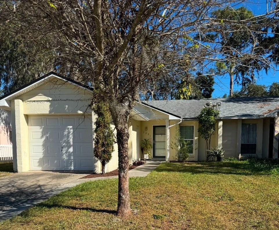 Turnkey Charm in Winter Park! This beautifully remodeled 3-bedroom, 2-bathroom home offers the perfect blend of style and convenience. Step inside to find durable ceramic tile flooring flowing through a spacious family room, perfect for entertaining. The home features a 1-car garage with a functional laundry area equipped with a washer and dryer tucked neatly in the back, alongside a fantastic outdoor setup. Relax on your open, screened-in patio overlooking a massive, fully fenced backyard. Freshly updated inside and out, this move-in-ready gem is ready for its next owner!