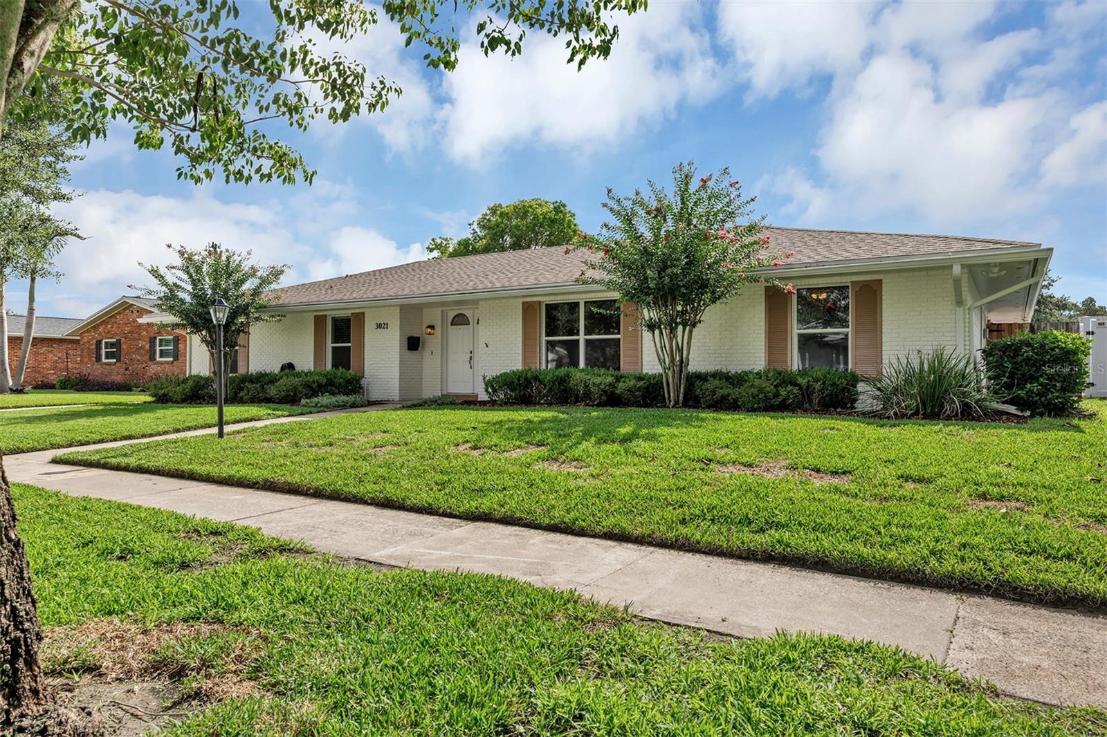 This charming 4 bedroom, 2.5 bath ranch style home is nestled on a quiet street in the Greenbriar neighborhood, just south of Downtown Orlando. Freshly painted exterior and interior, floor to ceiling. Home features a large open floor plan with a contiguous family room, kitchen, dining room area and a wood burning fireplace. Kitchen is built for entertaining with all stainless-steel appliances and 2 ovens, one in the island. There are ample cabinets and counter space in the kitchen and dining area. Recessed lighting in kitchen, dining and foyer. French doors lead out to a screened-in patio and there is a separate outdoor pavilion perfect for weekend BBQs with 3 ceiling fans, electric connectivity and all new exterior lights.  

Master bedroom has tile floors and a generous walk-in closet. The other 3 bedrooms have all new carpet and closet doors. The backyard is fenced with room for a boat, as the neighborhood is only 1.3 miles from public access to the Conway Chain of Lakes. Other exterior upgrades include a new garage ceiling with new interior lights, new septic tank and drainfield. This home is in the highly desirable Pershing K-8 and Boone High School district and is walking distance to Fort Gatlin Recreational Club with public pool, tennis courts and basketball courts. Proximity to SoDo, Downtown Orlando, fantastic hospitals, regional and international airports, plus quick access to I-4 and the East/West Expressway. Schedule your showing today.