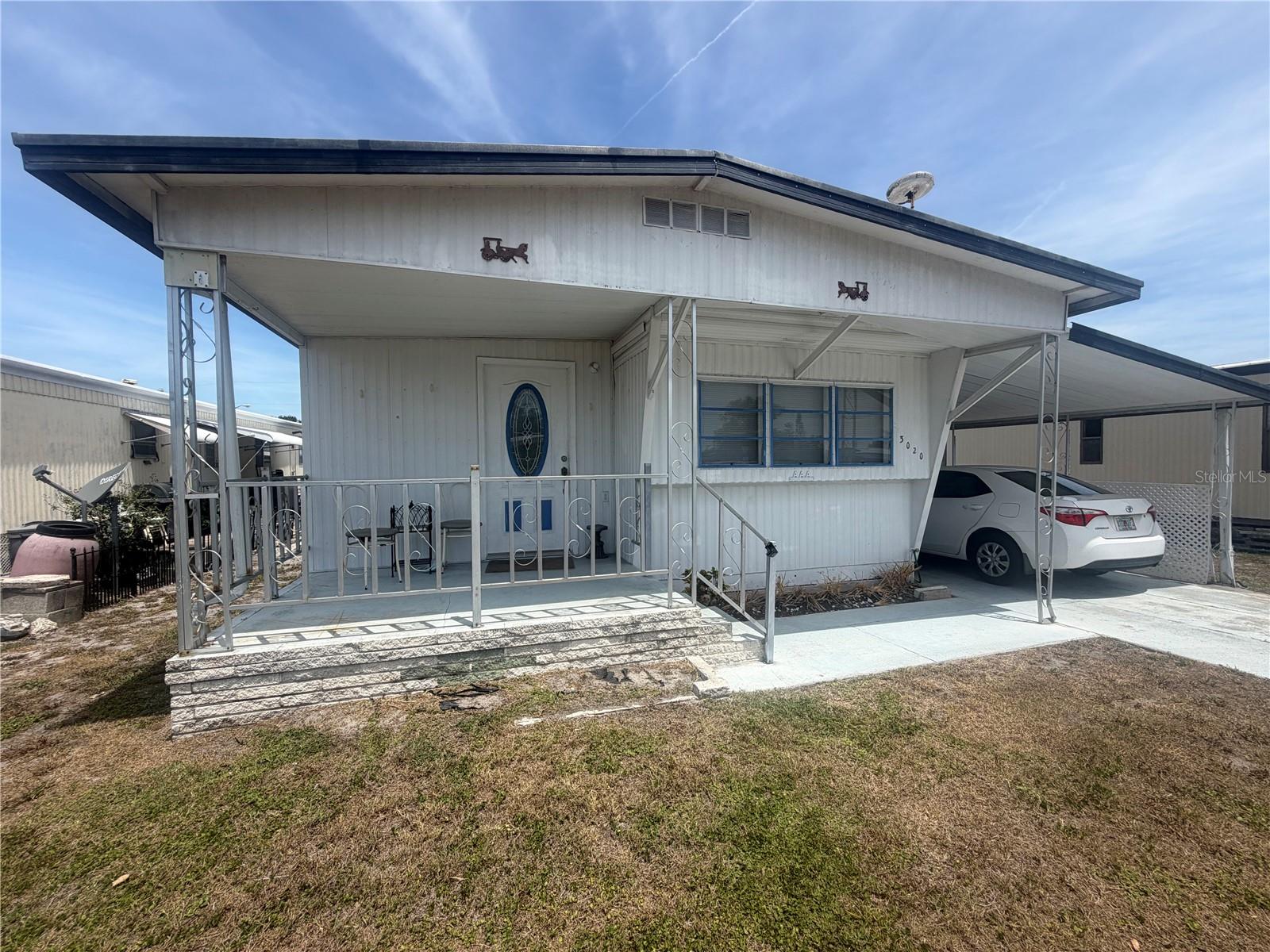 REDUCED!! Welcome to 3202 Sego Lane!!  Land Owned!  No Lot Rent!  This 2 bedroom, 1.5 Bath mobile home has been taken care of and is ready for a new Owner!  Brand New A/C is only a couple weeks old and is valued at $11,000....it's top of the line!  One year old Hot Water Heater, lots of Storage area under the Carport with an additional Storage/Utility Room. Skyview Estates offers a peaceful setting with great amenities, including a clubhouse with a full kitchen and library, shuffleboard courts, a dog park, scenic walking paths, and a private fishing pier on Blue Lake stocked with a variety of fish!! Make an appointment to see this cutie today!