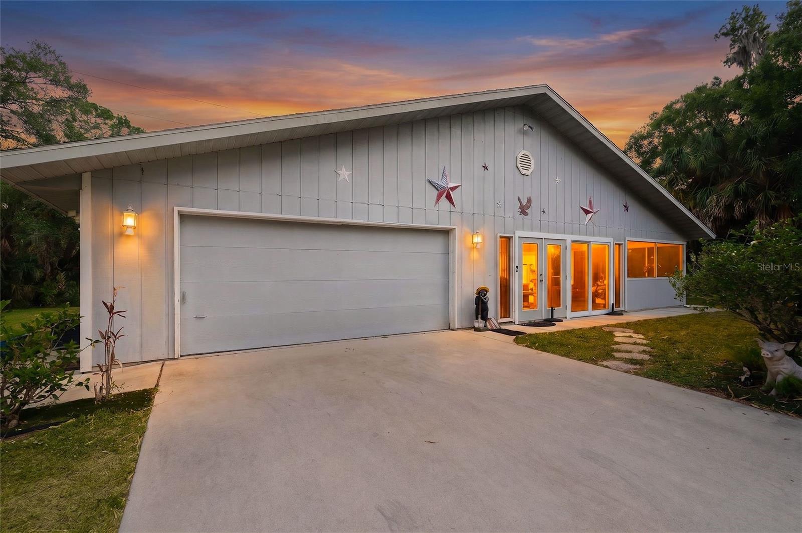 Tucked away on 2.15 private acres in the heart of DeSoto Acres, this One-of-a-Kind 3-bedroom, 3-bath property captures the essence of “Country Estates in the Heart of Town.” Spanning more than 850 acres of 2+ acre homesites, DeSoto Acres—renamed in 1945—remains Sarasota County’s largest RE-1 low-density community, celebrated for its rustic charm, canopy roads, and equestrian-friendly lifestyle just minutes from city conveniences.
This inviting home offers exceptional versatility, making it an ideal primary residence, investment opportunity, or income-producing rental. Step inside to a welcoming, light-filled Florida sunroom that flows seamlessly into a screened patio—perfect for enjoying peaceful mornings and breezy evenings surrounded by nature.
The thoughtfully designed layout includes a spacious primary suite with an en suite bathroom, large walk-in closet and a slider door that provides access to the tranquil side yard. A guest bedroom features a bonus den with direct access to a screened rear porch—an ideal retreat overlooking the shady, tree-filled preserve where birdsong and natural beauty abound.
Adding even more value is a private 1-bedroom, 1-bath apartment with a kitchenette and separate entrance (completed in 2024), offering excellent potential for rental income, guest accommodations, or multigenerational living.
The cozy main living area is anchored by a striking rock hearth fireplace and complemented by a Vermont Castings wood-burning stove, creating a warm and welcoming atmosphere. Recent upgrades include impact entry doors and a newer hot water heater for added peace of mind.
Practical features abound with a 2-car carport, an attached 2.5-car garage, and ample storage space. Outdoors, the expansive property truly shines—featuring a 20' x 10' livestock corral ready for chickens, mini cows, or even a horse. With no deed restrictions, you’ll enjoy unmatched freedom, privacy, and the flexibility to create your own country lifestyle.
This is a rare opportunity to own a slice of Old Florida charm with room to grow, invest, and live freely—all in a highly sought-after Sarasota location.
