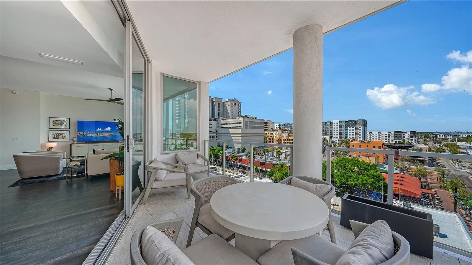 Welcome to The Mark, a contemporary residence in the heart of downtown Sarasota. This sixth-floor corner condominium spans 2,112 square feet of interior living space with an additional 170-square-foot terrace offering panoramic city views. The open-concept floor plan integrates the kitchen, dining, and living areas, all framed by 10-foot ceilings, motorized shades, ceiling fans, and custom porcelain tile flooring. The kitchen features an induction cooktop with a hood, a convection oven, a microwave, a tiled backsplash, an RO drinking water system, a French-door refrigerator with an ice and water dispenser, and a large island for entertaining. Each of the three bedrooms includes a private en-suite bath, with the primary suite offering two closets (including a walk-in), a ceiling fan, and a spa-inspired bath with dual vanities and a multi-head walk-in shower. A powder room, a dedicated laundry room with full-size appliances and cabinetry, and a den designed for work or leisure complete the interior. This 2019-built residence includes Cat-5 impact windows, Cat-5 ethernet wiring throughout and a secured storage space on the same floor. One reserved parking space is on the third level of the secured garage. The building is outside a designated flood zone. Amenities at The Mark include a 60-foot resort-style pool with an infinity edge, swim lane and full-length bench seating, a spa, two gas grills, a gas firepit with lounge seating, a fitness center with a spin/Pilates room, a clubroom with full bar, large TVs and a pool table, a business center and conference room for resident use. Residents benefit from 24/7/365 front desk staff, secured lobby access and overnight roving security. Enjoy immediate access to Sarasota’s renowned restaurants, shopping, arts venues and the harbor. The Mark, where downtown is downstairs.