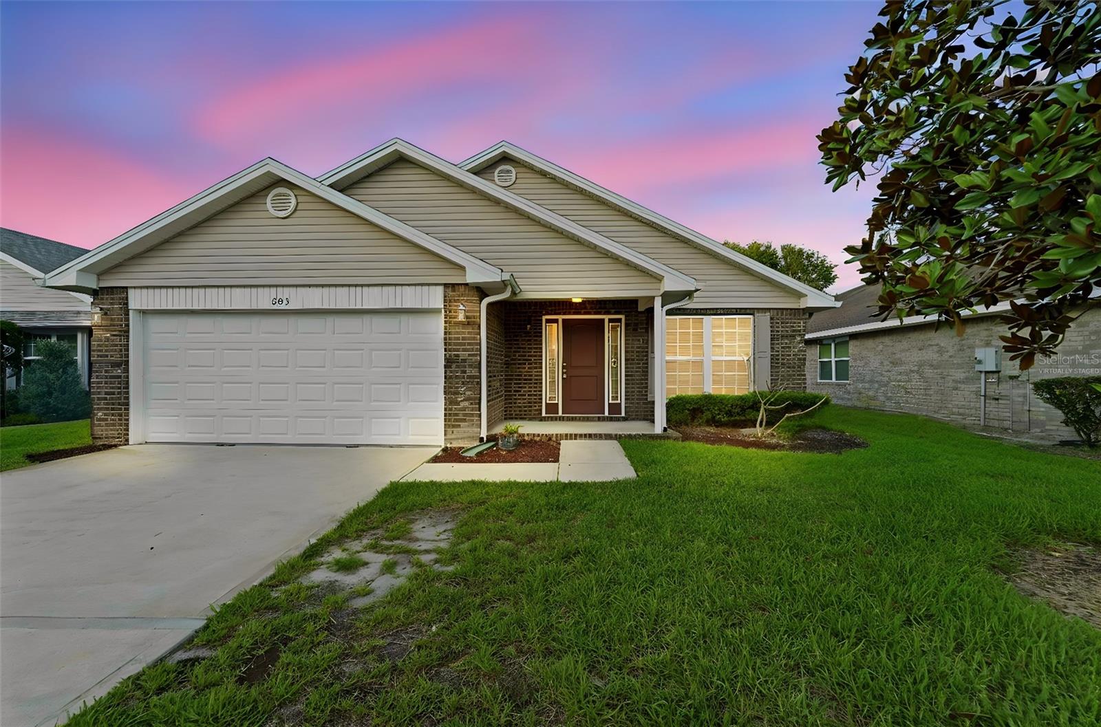Virtually Staged. Tucked inside the gated community of Coral Trace, this 3-bedroom, 2-bath home offers comfortable Florida living with a thoughtful single-story layout, 2-car garage, screened back porch, and fenced yard. Inside, updated flooring, neutral finishes, and practical living spaces create a welcoming setting for everyday living. Coral Trace features a community pool and clubhouse, along with a convenient Edgewater location near I-95, shopping, dining, medical services, schools, boat ramps, the Intracoastal Waterway, New Smyrna Beach, and area beaches. A wonderful opportunity to own in an established neighborhood at an attractive price point.