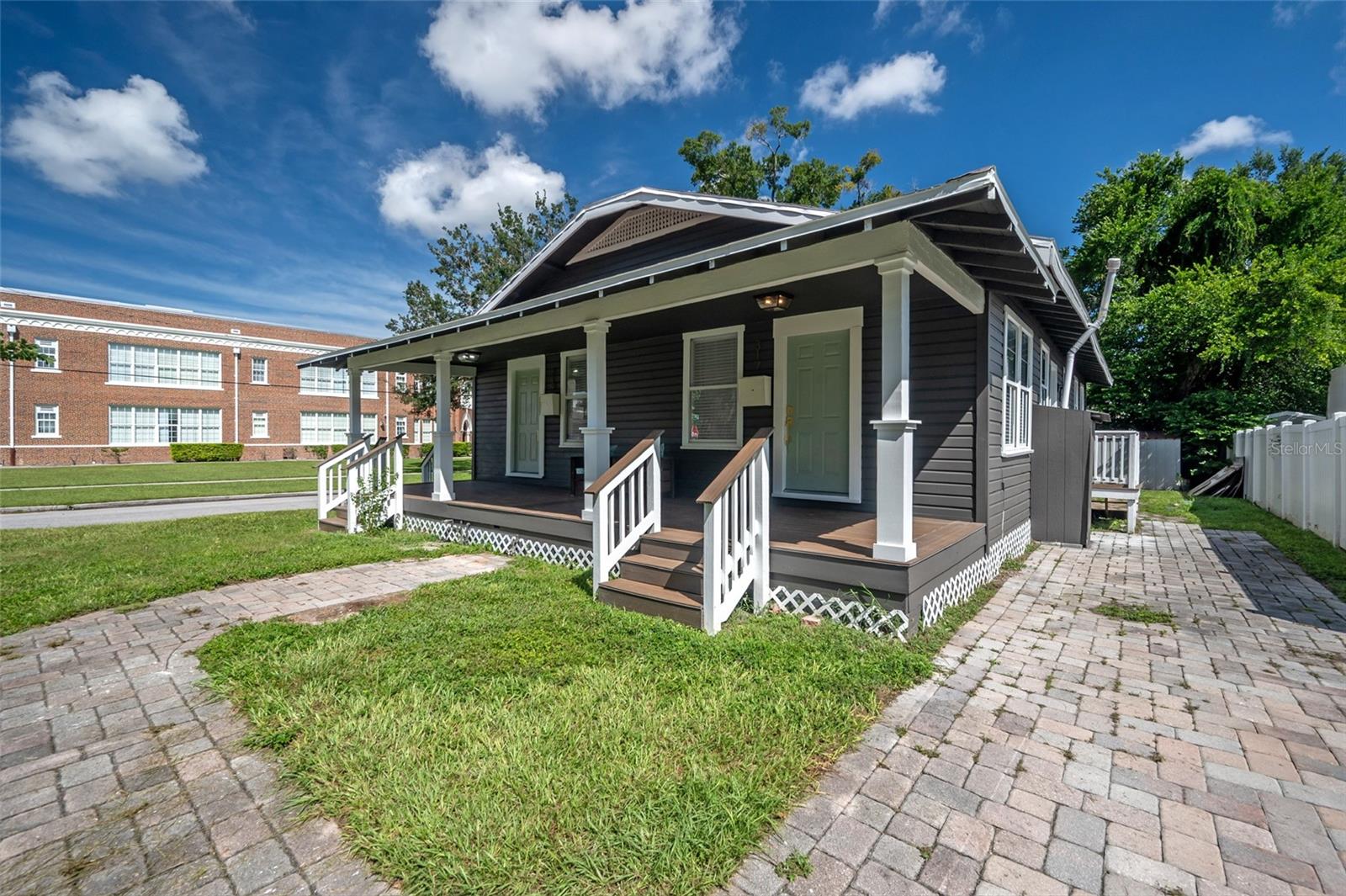 Fully renovated, income-producing duplex in the heart of South Seminole Heights—an exceptional opportunity for investors looking for immediate cash flow, long-term appreciation potential, or a house-hack strategy in one of Tampa's most sought-after neighborhoods.

Situated on a prominent corner lot, this turnkey property consists of two 2-bedroom, 1-bathroom units, each approximately 750 square feet. One unit is currently leased as a long-term rental for $2,100/month, while the second unit is a fully furnished and stocked mid-term/short-term rental currently advertised on Furnished Finder with rental income of $2,500/month.

Both units have been extensively renovated within the past five years, offering low-maintenance ownership and modern amenities that appeal to today's tenants. The kitchens were completely redesigned and reconfigured to maximize functionality and include in-unit laundry. Features throughout both units include quartz countertops, white shaker cabinetry, durable scratch-resistant wood laminate flooring, decorative living room fireplaces, spacious bedrooms, abundant natural light, Sherwin-Williams interior and exterior paint, updated plumbing, new electrical panels, and natural gas service connected to the ranges, dryers, and water heaters. Each unit has its own paver driveway (unit 317 is in the front, and unit 319 is behind the house with a walkway to the side entrance).

Unit 317 features a vent hood over the gas range, a bathroom with a tub/shower combination, pedestal sink, and linen closet. Unit 319 features a built-in microwave above the range, a beautifully updated bathroom with a tiled shower and glass enclosure, wood storage vanity, linen closet, and a tankless gas water heater.

Additional capital improvements include a fully rebuilt front porch with composite decking and two newer TRANE HVAC systems. Units are metered separately for gas and electric, with one meter for water. Fumigated for drywood termites in June 2025.

The location is equally impressive. Just around the corner from Rivercrest Park and within walking distance of neighborhood favorites including Spaddy's Coffee, La Segunda Bakery, Common Dialect Brewing, Health Mutt, Ichiban Sushi, Independent Bar & Café, and numerous other local restaurants and shops. Residents are also less than five minutes from Armature Works, the Tampa Riverwalk, Downtown Tampa, and major employment centers.

Whether you're looking to expand your portfolio with a stabilized income-producing asset or take advantage of the flexibility offered by a mixed long-term and furnished rental strategy, this South Seminole Heights duplex presents a rare opportunity in a high-demand rental market.
