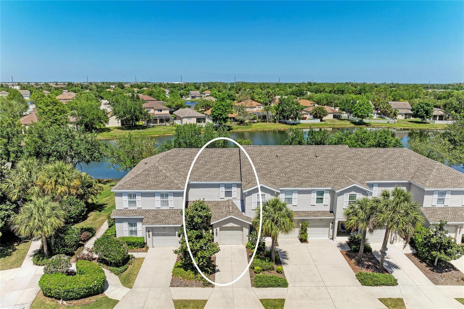 One or more photo(s) has been virtually staged. Welcome to this charming 2-bedroom, 2.5-bathroom townhome located in the highly sought-after Greenbrook Walk community in the heart of Lakewood Ranch. This well-maintained residence offers a functional and inviting layout, perfect for comfortable everyday living.  The kitchen features stainless steel appliances and opens seamlessly to the family room, creating an ideal space for entertaining or relaxing. The main living area is finished with ceramic tile, adding both style and easy maintenance.  Upstairs, you’ll find two generously sized bedrooms, each with its own full bathroom, including a primary suite designed for privacy and convenience. A downstairs laundry area with a washer and dryer included adds to the home’s practicality.  Step outside to your screened lanai and enjoy peaceful pond views, perfect for morning coffee or unwinding at the end of the day.  Residents of Greenbrook Walk benefit from access to A-rated schools, scenic walking trails, and a community pool which is just a short walk away.  The community is in a prime location close to a wide variety of dining and shopping options. Plus, you’re just a short drive from world-renowned Gulf Coast beaches.  This townhome offers the perfect combination of comfort, location, and lifestyle. Don’t miss the opportunity to make it yours.