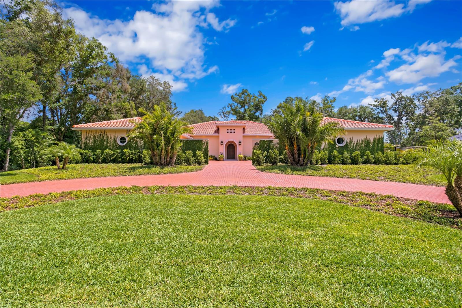Step into the world of luxury living in this NEW CONSTRUCTION, MOVE-IN READY custom residence located in Tampa’s Avila Golf & Country Club, known for its resort lifestyle and privacy. The authentic architecture is based on the historic mansions of Palm Beach. The builder personally oversaw the construction and used only the finest, top-tier materials and best craftsman. The 3/4 acre private homesite was selected since it is optimally located with only one neighbor and surrounded by concrete walls and private conservation. This high-performance home has top-percentile energy results and the meticulous construction standards. The structure is 100% concrete block. The windows are hurricane-rated and very energy efficient. The roof is durable Mediterranean tile. The upgraded Carrier AC includes dehumidification and filtered fresh-air. The extensive insulation includes spray foam attic and walls to ensure optimum comfort and efficiency. Upon arrival, you are greeted by a custom designed metal entrance door and the open floor plan which flows seamlessly to your resort-style pool and spa creating a harmonious blend of indoor and outdoor living.  The home is 7,194 sf with 5,028 sf of living space and additional 2,166 sf of covered entertaining areas. The one-story floorplan includes 4 spacious bedrooms (including 2 suites), 5 bathrooms, home office, gym/flex room, laundry room with stacked washer/dryers, outdoor kitchen, and spacious 6-car garage.  In addition to being breathtaking, the gourmet kitchen is an entertainer’s dream. Cabinets are custom designed and some include motorized operation. The custom island was engineered to float above the floor and includes custom lighting. Book matched quartzite counters and full height backsplash were hand selected. Top-of-the line True, Miele and Bosch appliances are included. The secondary Chef’s Kitchen is both functional and assures perfect organization. The area includes a 42” Monogram side-by-side refrigerator, 27” Monogram oven, secondary Bosch dishwasher, 30” Ruvati workstation sink, and custom cabinetry. The Owner’s Suite is the perfect sanctuary for relaxation and enhanced well-being. The spa-inspired Owner’s bathroom includes a Turkish marble shower with full height glass enclosure for steam use, separate vanities with flanking custom stained cabinetry, oversized water closet, authentic Finnish Sauna, and a sunken soaking tub with imported rocks. An oversized master closet can be designed to fit your unique style (includes a hidden room). 3 additional ensuite bedrooms with walk in closets complete the home. Each bathroom has floating cabinetry, marble and quartzite counters, and premium tile and fixtures. The floorplan is complete with a Home Office and a Gym/Flex Room that can be converted to a 5th bedroom with its own bathroom. The 6-car garages are showroom quality. The outdoor living space is magnificent and includes a modern oversized salt water pool, sunken hot tub, oversized sun shelf, entertaining sun deck, and private pool bathroom. While enjoying the resort-style pool, you will love the outdoor kitchen and bar which includes a 36” Alfresco gas grill, True refrigerator and Scotsman gourmet ice maker.  If you are looking for the best quality and design, it is worth a tour to see things firsthand. We invite you to tour this move-in ready Avila estate home.