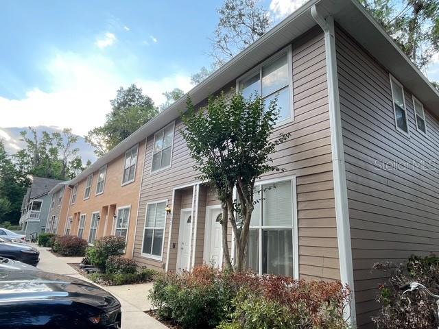 Welcome home! This well-maintained END unit 2-bedroom, 2.5-bath condo offers the perfect combination of comfort, convenience, and location in the heart of SW Gainesville. Just minutes from the University of Florida, UF Health/Shands Hospital, Butler Plaza, Celebration Pointe, shopping, restaurants, and I-75. This spacious two-story floor plan features an open living and dining area, a convenient half bath downstairs for guests, and a functional kitchen with plenty of cabinet space. Upstairs, both bedrooms feature private en-suite bathrooms and vaulted ceilings, making it ideal for roommates, professionals, or investors. Enjoy a private patio, in-unit washer and dryer, community pool, and easy access to bus routes to the UF campus. Brighton Park is a highly desirable community known for its convenient location and low-maintenance lifestyle.