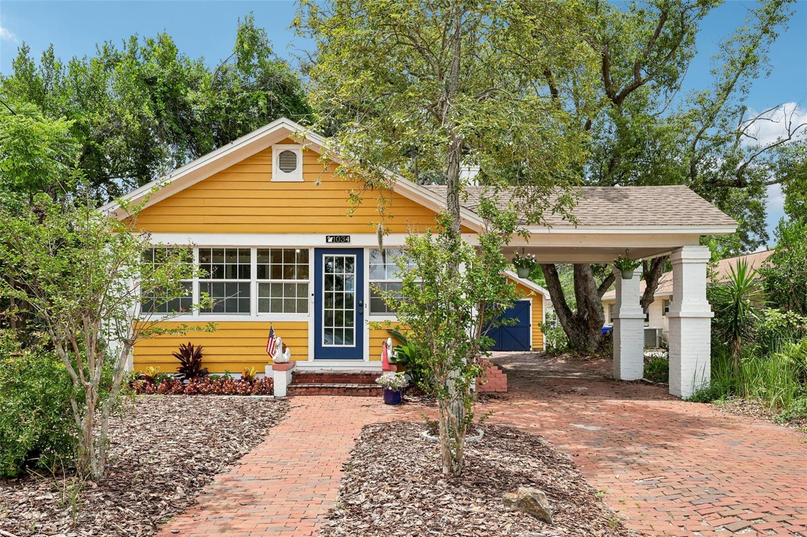 Nestled on a charming brick street, this terrific 1937 bungalow radiates character and warmth.  This 3-bedroom, 1-bathroom home greets you with an enclosed front porch leading into a sun-drenched living area featuring a beautiful fireplace, central heat and air, and plenty of windows. Throughout the home, timeless historic touches like original hardwood floors, crown molding, 8-inch baseboards, and vintage glass door knobs blend seamlessly with a tastefully updated kitchen and bathroom. Massive structural and mechanical upgrades provide ultimate peace of mind, including a 2024 full roof replacement, a 2024 whole-house electrical rewiring, modern PVC and PEX plumbing, a newer water heater, a 2025 AC blower motor and relay replacement, a 2025 attic exhaust fan, a newer gas stove (2024), and high-speed fiber internet. Furthermore, the property benefits from a 2021 crawlspace structural repair with three IntelliJacks (backed by a transferable warranty), a 2025 full structural termite fumigation with an active bond, and a freshly leveled and re-mulched front yard (2026). Outside, the enchanting backyard invites you to explore its brick-paved paths winding through a lush garden filled with mature landscaping, flowering plants, and seasonal fruit trees. Completing this exceptional property is a 162-square-foot finished carport and a 354-square-foot detached garage workshop, all perfectly situated in a prime, central location close to downtown Lakeland, Bonnet Springs Park, and everything the greater Lakeland area has to offer.