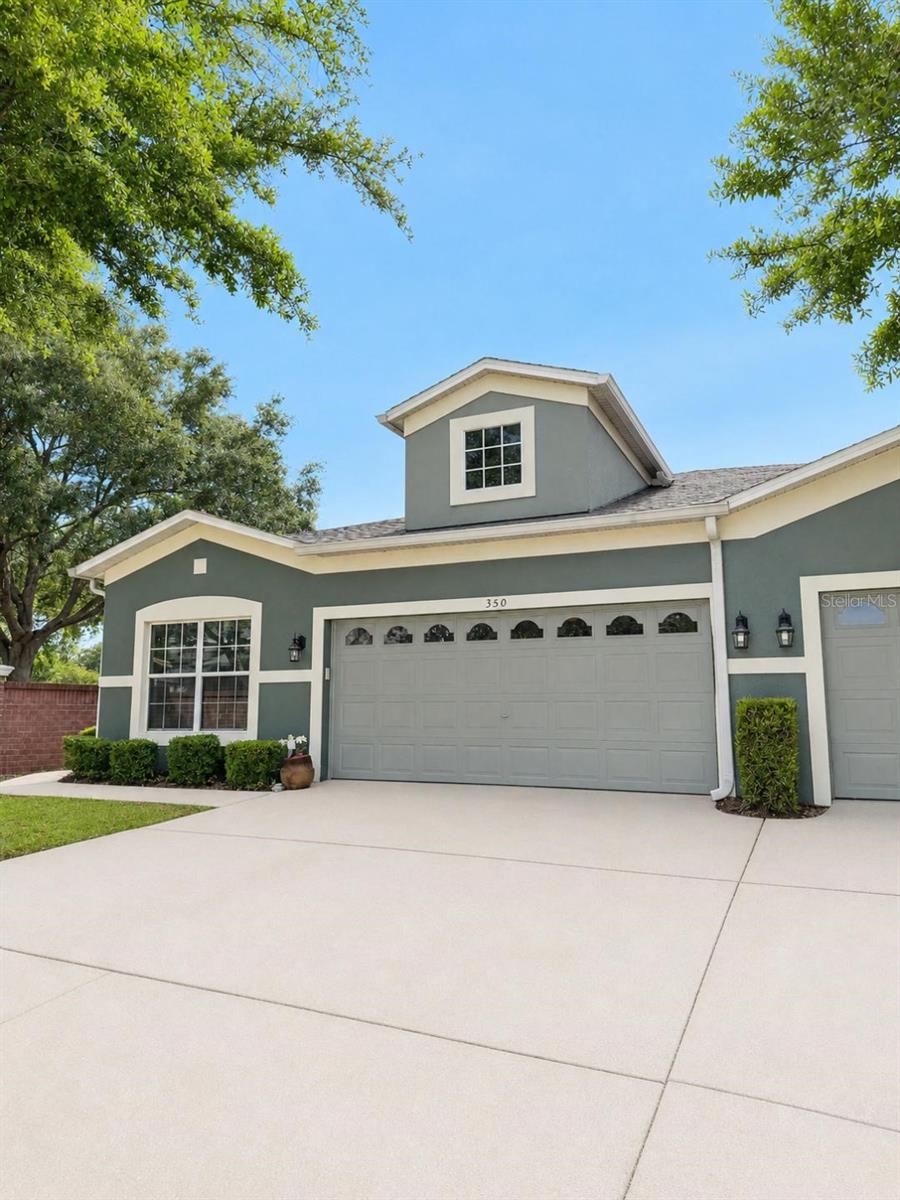 Move right into this beautifully maintained one-story end-unit townhome located in a desirable gated community within the highly sought-after Lake Mary school district. This move-in-ready 3-bedroom,2-bath,and 2-car garage home features a spacious split-bedroom floor plan with soaring high-volume ceilings, abundant natural light, and wood flooring throughout the main living areas.

The kitchen offers granite countertops, ample cabinetry, and plenty of space for cooking and entertaining. Elegant crown molding and seven ceiling fans add style and comfort throughout the home.

The spacious primary suite offers a walk-in closet and private bath, while the second bedroom is equipped with a built-in Murphy bed, maximizing both comfort and functionality. Additional features include a laundry closet to accommodate a full size washer and dryer, an alarm system, fire sprinkler system, garage attic access, and a utility sink.

Relax year-round on the screened porch and enjoy low-maintenance living with access to the community pool. Perfectly situated just steps away from the neighborhood park/playground. Conveniently located near top-rated schools, shopping, dining, and major highways, this gently lived-in home is truly move-in ready.