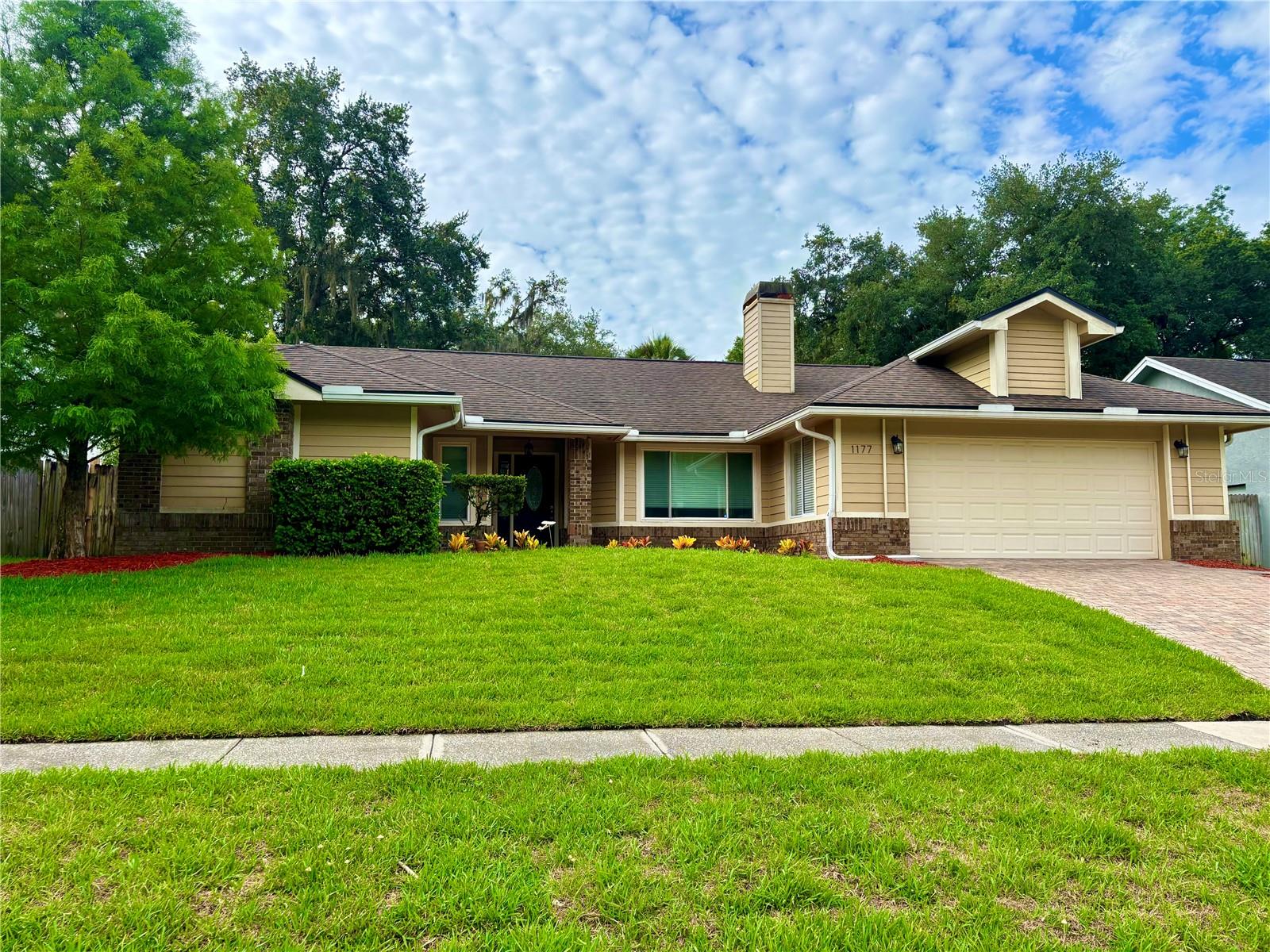 WELCOME HOME! Pool maintenance and grounds care are included, allowing you to enjoy Florida living at its finest. Welcome to this beautifully maintained 4-bedroom, 2-bath home in the highly desirable Oak Forest community. Upon entering, you'll be greeted by an open and inviting floor plan with stunning views of the sparkling pool and covered lanai—perfect for year-round entertaining and relaxing outdoor gatherings. The home features gorgeous wood flooring throughout, offering both style and easy maintenance. The spacious kitchen is a chef's delight, complete with travertine flooring, a center island, ample counter space, and bar seating for casual dining. Just off the kitchen, unwind in the comfortable family room featuring a cozy wood-burning fireplace. Ideally located near shopping, dining, parks, and major roadways, and top-rated schools.  This home offers the perfect combination of comfort, convenience, and Florida lifestyle.  Renter's insurance is required. Schedule your showing today!
