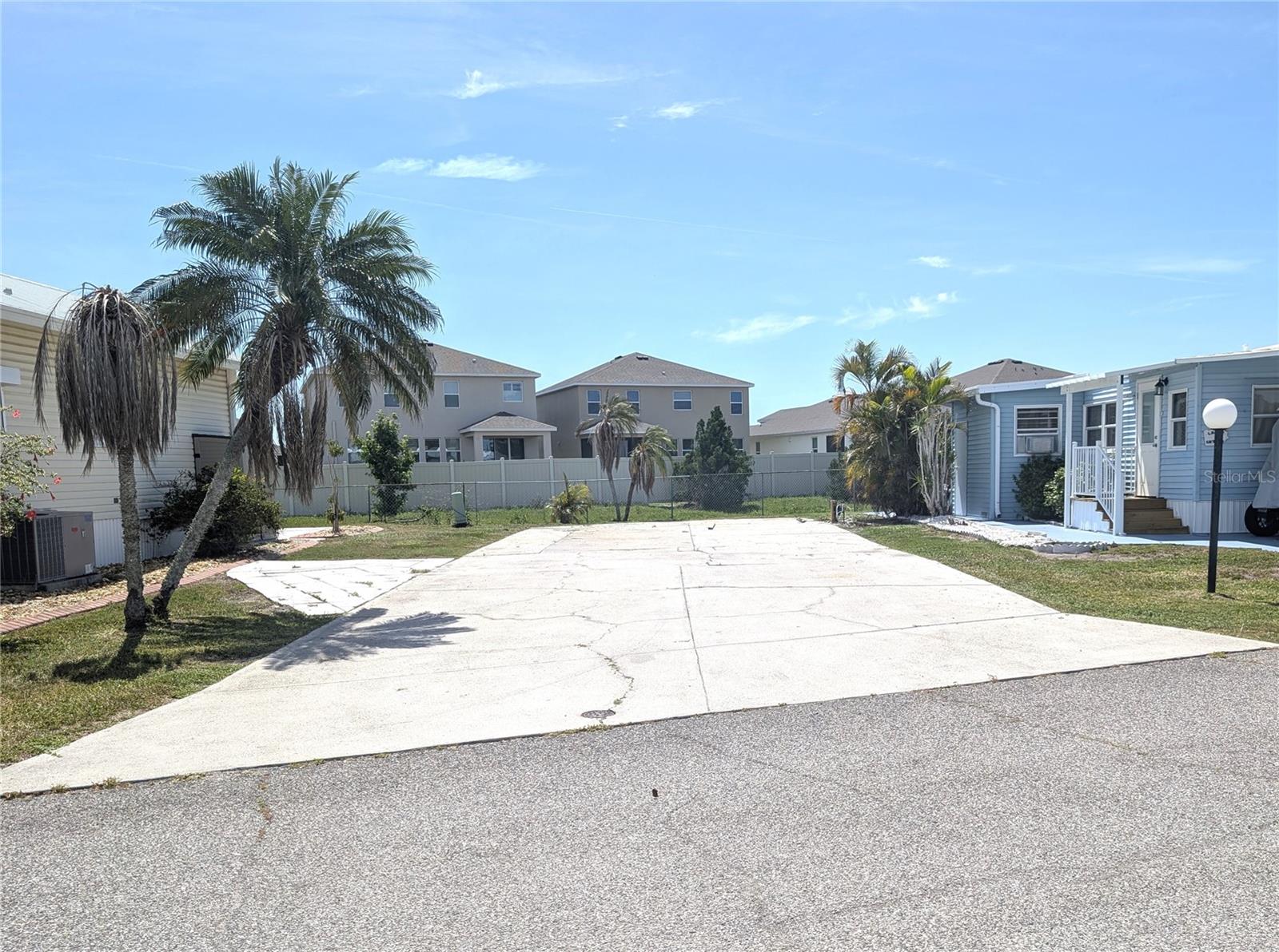 This large RV lot is ready for you to come enjoy the winter activities in Florida! The large cement pad will accommodate most RV's. In addition, a new 50 amp electric service has been installed. This lot backs up to a privacy fence, so you are not looking at other mobile homes with green space behind the lot. This 55+ community features two pools, hot tub, pickleball and tennis, shuffle board and various other activities to keep you active. The HOA fees include all recreational facilities, mowing, internet, cable, sewer, water and trash. You can't beat the value of this community!