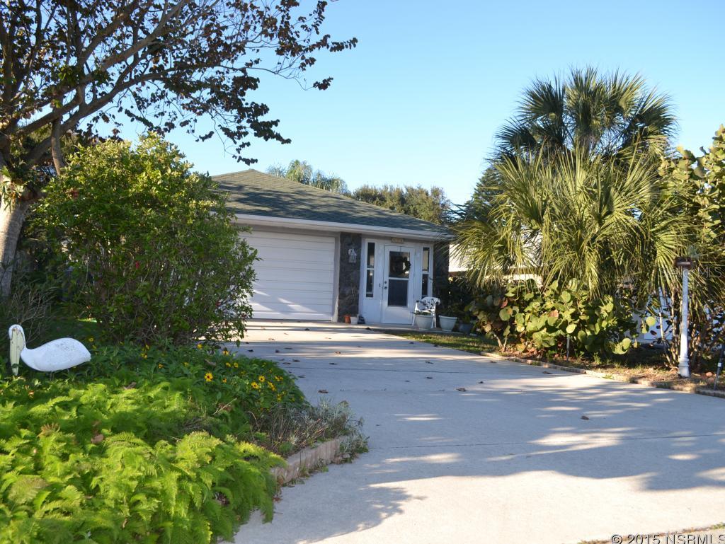 Beach House one block from the beach. Open floor plan with high ceilings.  Cozy eat in Kitchen.  Florida room for morning sunshine.  Living area offers views of back yard landscape.  Master bedroom includes large walk-in closet and private bath.  Good closet and garage storage for all the extra beach toys. ;Water: City