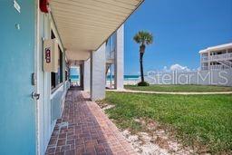 Experience oceanfront living in this fully furnished 1 bdrm/1 bth condo, conveniently located on the 1st floor here in New Smyrna Beach.  Enjoy your morning coffee watching the sun rise just outside your front door or taking your morning stroll along the beach with easy access from your unit.  This condo unit offers exceptional rental flexibility with no minimum stay requirements, making it an ideal investment property, vacation rental, or personal beachfront escape.  The HOA covers utilities, cable, Wi-Fi, insurance, and exterior maintenance—providing effortless, low-maintenance ownership.  This coastal retreat is less than 4 miles from Flagler Avenue, where you will find many of our favorite local restaurants to select from, unique shopping, nightlife.  Don’t miss this opportunity to own your very own piece of heaven here in New Smyrna Beach!!