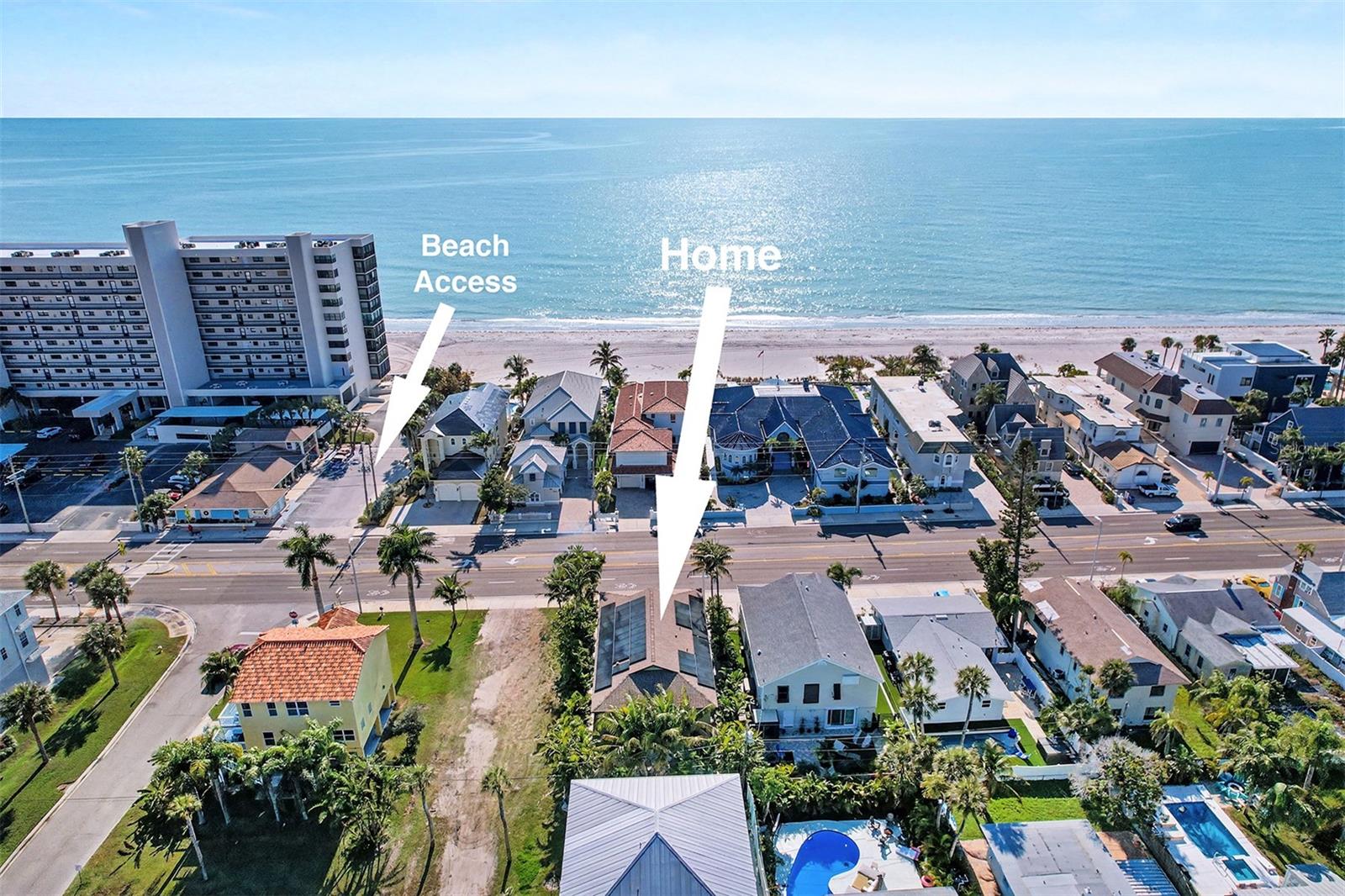 Stunning elevated beach home in sought-after Redington Beach, ideal for entertaining. This three-bedroom, two-bath residence offers 1,969 square feet of bright open interior living with about 4,000 total square feet, including 1,100 square feet of covered outdoor living space, with partial ocean views from the front balcony and easy beach access nearby. Recently renovated with marble-inspired large tile, quartz counters, stainless appliances and an expansive kitchen ideal for gatherings. Both baths feature custom tile, new vanities and glass enclosures, and the primary bath includes a bear claw soaking tub. The main suite spans the entire left side of the home, and bedrooms two and three are spacious with abundant natural light. Interior highlights include an onyx window above the staircase, Hunter Douglas blinds, inside laundry with sink/cabinet/ironing board, and a smart thermostat. Outstanding outdoor and mechanical upgrades include covered downstairs porch with a built in kitchen with natural gas grill/cooktop and sink, tropical landscaping, paver patio, LED landscape lighting, 52 LUNEX solar panels, Tesla Powerwall, Lifesource salt-free water purification, new GAF lifetime architectural roof, Trane XV20i 4-ton air conditioner on aluminum stand, attic dehumidifier with R8 insulation, and Mitsubishi mini split in the garage. Additional features include a four-car air-conditioned garage with four doors/openers and vaulted ceilings, all block construction, hurricane-rated PGT windows and doors, articulating Bahama shutters, sprinkler system on reclaimed water, and generous walk-in closets. Experience elevated Florida beach living, modern, efficient and built to entertain.