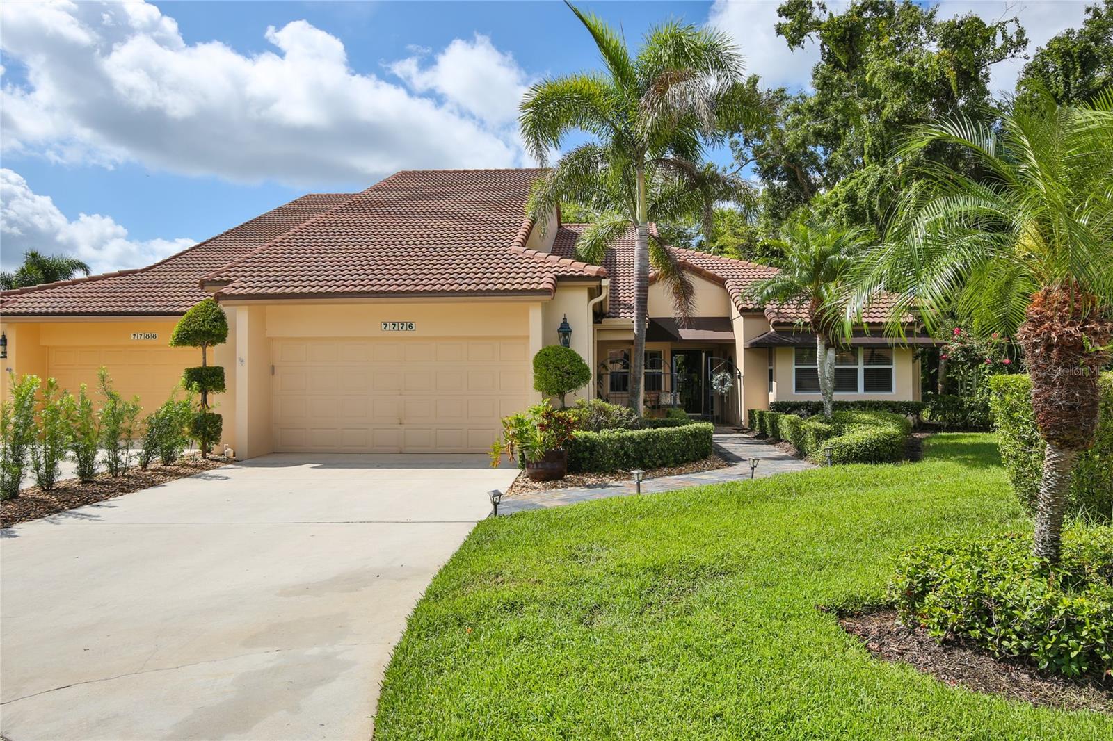 Welcome to 7776 Calle Facil! This stunning house, located in the renowned TPC Prestancia gated community, is now available for sale. Offering a maintenance-free lifestyle and an array of desirable features, this property is sure to capture your attention.

Situated on a peaceful cul-du-sac, this updated home boasts a spacious and inviting interior. With three bedrooms and two and a half bathrooms, there is plenty of room for everyone to enjoy. The high ceilings throughout the house create an open and airy atmosphere, while the vaulted ceilings in the primary suite and family room add an extra touch of elegance.

As you enter the property, you'll be greeted by a well-maintained interior that showcases attention to detail and quality craftsmanship. The generously sized family room with a full wall of retractable sliders allow for a seamless transition between the interior and exterior spaces, perfect for entertaining or simply enjoying the beautiful Florida weather. The lush surroundings around the newly pavered lanai, provide privacy, creating a serene garden oasis where you can relax, swim and unwind.

The primary suite is a retreat in itself, complete with an en-suite bathroom and a slider that opens to the lanai.  Wake up to beautiful views and step outside for a refreshing morning swim. The kitchen is a chef's delight with its quartz countertops and ample storage space. Whether you're hosting a dinner party or preparing a meal for your family, this kitchen is sure to impress. The large laundry room offers convenience and functionality, making household chores a breeze.  Pets are welcome in this community, allowing you to enjoy the company of your furry friends. Parking and storage will never be an issue with the two-car garage that features epoxy coating for added durability. 

Located on a quiet street, this property offers tranquility while still being within close proximity to all that Sarasota has to offer. From The Siesta Key Beaches to shopping and dining options to cultural attractions and outdoor activities, there's something for everyone in this vibrant city.