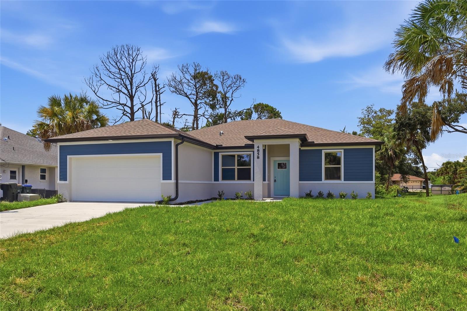 NOW OFFERING 3% TOWARDS CLOSING COSTS WITH PREFERRED LENDER. Great price with luxury features and ready now! A newly constructed home with city water and septic system in North Port, with no HOA fees! Great location for quick access to I-75 off Sumter Blvd. for an easy commute to Sarasota, plus nearby shopping, medical conveniences, parks and schools. You will also be near the City Center for your convenience! This affordable new home is ready for you and is just what you've been looking for...No HOA and with city water! This home has 9'4" tall ceilings, a nice open layout with a versatile floor plan. The house features 4 bedrooms, 2 full bathrooms, dining room, a living room, an open kitchen and a 2-car garage with 1810 square feet of living space. The living space is well utilized with high ceilings and many windows providing natural light. The interior features will provide you with the quality and luxury you were looking for in your new home. This home has a split floor plan with the primary suite on one side of the home and the guest bedrooms on the other. The primary bedroom has a tray ceiling and large windows that bring in lots of natural light. You'll also enjoy a resort-style bathroom with a spacious walk-in shower with tiled walls and a glass enclosure. It also features a linen closet, double vanity and a large walk-in closet. The living room features large windows and several LED fixtures providing plenty of light with access to the covered lanai. The living room is open to the kitchen, where you'll find a huge center island with extra seating for casual dining and plenty of cabinets. The kitchen features stainless steel appliances, Shaker-style cabinets with crown molding, decorative hardware, subway tile backsplash and granite countertops. The dining room is located at the front of the house, with large windows allowing for plenty of natural light. The home includes luxury vinyl plank flooring in the main living areas and bathrooms for durability and comfort. You'll love these floors! They are easy to maintain and offer a modern design, perfect for new homes. Other features include the same beautiful Shaker-style cabinets with hardware and granite countertops in the bathrooms, 5-inch baseboards, a garage door opener, gutters on the exterior, R38 insulation, a 16 SEER HVAC and much more. Visit our model center and compare the features and quality with other homes and you'll see the difference. We make buying easy for you!
