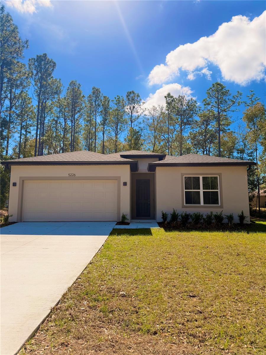 Welcome to 5226 E. Prentice Ln., Inverness, FL – a beautifully crafted 4-bedroom, 3-bathroom home designed with both style and functionality in mind. This brand-new construction offers a spacious open-concept layout, perfect for modern living and entertaining. Step inside to find gorgeous luxury vinyl plank flooring flowing throughout the entire home, creating a seamless and durable finish. The light-filled great room opens to a designer kitchen featuring shaker-style cabinetry, sleek countertops, stainless steel appliances, a large center island with sink, dishwasher, and ample storage space. One of the standout features of this home is the rare two primary suites, ideal for multi-generational living, guests, or added flexibility. Each suite offers generous space and well-appointed bathrooms. Additional highlights include: - 4 spacious bedrooms - 3 full bathrooms - Open-concept living and dining area - Two-car garage - Recessed lighting -Covered rear lanai - Covered entry and clean modern exterior design Enjoy peaceful surroundings while still being conveniently located near shopping, dining, medical facilities, and outdoor recreation that Inverness is known for. Move-in ready and waiting for you to call it home — schedule your private showing today!