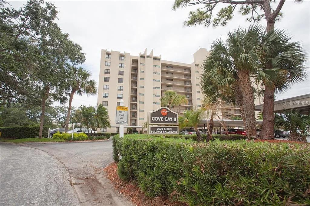 Resort-Style Living in Beautiful Clearwater! Welcome to your home at Cove Cay, a highly sought-after gated, golf course community offering the best of Florida living. This large, well-maintained first-floor studio condo delivers the perfect balance of comfort, convenience, and resort-style amenities. Step inside to find a bright, open layout designed to maximize every inch of space. The kitchen is equipped with modern appliances, ample counter space, and generous storage, ideal for preparing meals at home. The open living and sleeping area feels inviting and spacious, filled with natural light from large windows. Enjoy your morning coffee or evening breeze from your private patio with easy ground-level access, no stairs, no hassle. As part of the prestigious Cove Cay community, residents enjoy access to a marina with boat rentals, an 18-hole golf course, a sparkling pool and spa, a clubhouse, and on-site dining at Bayview Grill. Conveniently located near Clearwater Beach, shopping, dining, and Tampa Bay attractions, this condo offers a truly maintenance-free lifestyle. Whether you’re seeking a vacation getaway, full-time residence, or smart investment, this charming studio offers easy, comfortable living close to it all. Experience the best of Clearwater living where every day feels like a vacation at Cove Cay.