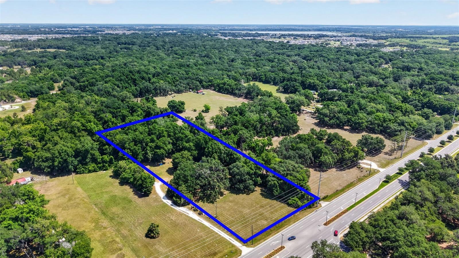 Exceptional opportunity to acquire 3 acres in a highly strategic growth corridor with potential for annexation into the City of Wildwood. Ideally situated on Warm Springs Avenue directly across from the Village of Fenney, this property offers outstanding visibility and exposure with nearly 19,000 daily traffic trips.

The location provides convenient access to residents of The Villages, one of the nation's fastest-growing master-planned communities, making it an attractive prospect for future commercial development or other potential uses. With strong surrounding growth and excellent road frontage, this property presents significant investment and development potential.

The value is in the land; the existing home is being sold as-is and is not considered contributory to the property's value. Buyers are encouraged to conduct their own due diligence and verify all information, including zoning, annexation possibilities, and future land-use opportunities.