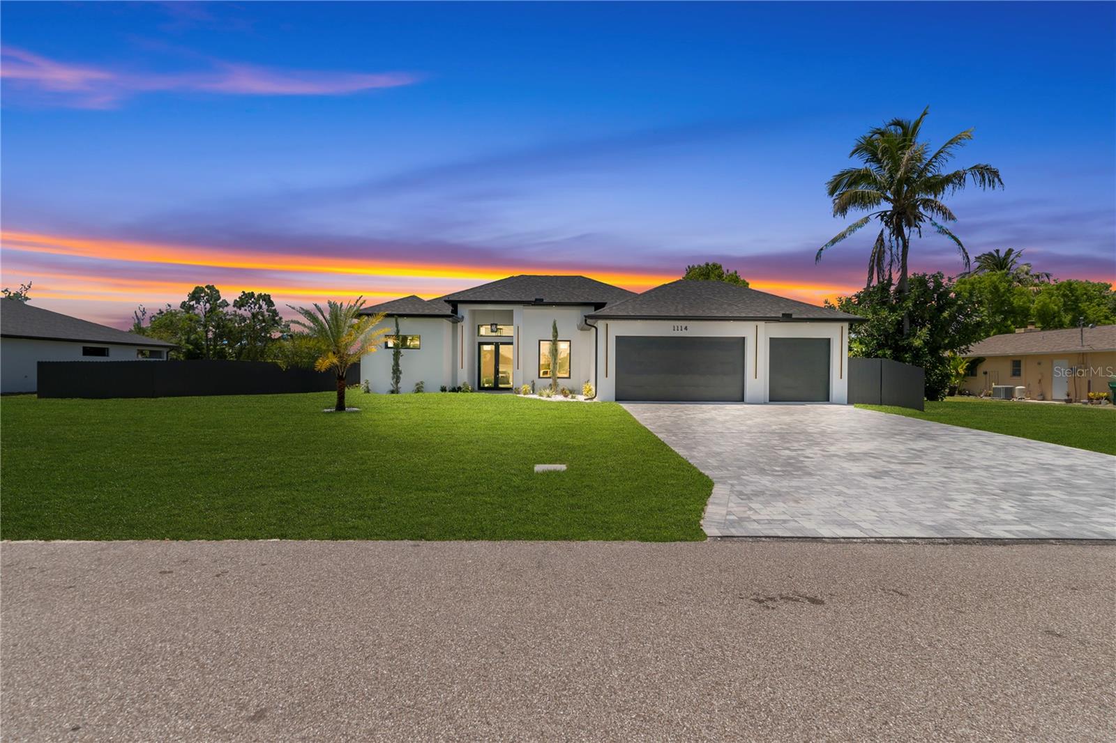 One or more photos have been virtually staged, AI generated, or rendered. This new construction waterfront home is thoughtfully designed to combine comfort, style, and functionality in a peaceful Florida setting. Situated on an oversized lot with city water and sewer, the residence offers privacy, spacious living, and modern finishes throughout. The open-concept layout is centered around a chef-inspired kitchen featuring a large island, quartz countertops, and elegant architectural details, while expansive living spaces are filled with natural light and create a seamless indoor-outdoor flow. Step outside to enjoy a resort-style pavered pool, outdoor kitchen, and tranquil freshwater canal views perfect for kayaking, paddleboarding, or relaxing evenings by the water. The split-bedroom floor plan includes a dedicated pool bath and a versatile fourth bedroom ideal for guests, a home office, or flex space. Additional highlights include a spacious three-car garage, modern lighting, heated floors in the primary bathroom, and quality construction designed for both everyday living and entertaining. Additional locations available.