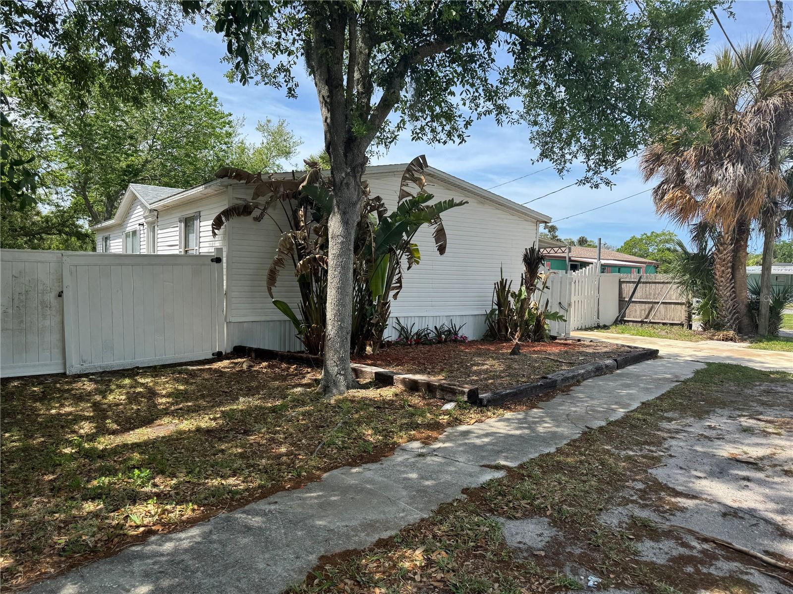 Spacious Manufactured Home awaits! Waterfront Opportunity in Pt Orange – No HOA or LOT FEE Can be an investment! Wake up to peaceful water views and end your day and relax. This charming waterfront home in Pt Orange offers the perfect blend of relaxation, lifestyle, with investment opportunity. This inviting home features an open-concept layout that connects to the living room, dining area, and kitchen, creating a bright and spacious feel. Natural light fills the home, while the water views relax you with privacy that is hard to find at this price. YES! You can fish all day and night! The kitchen offers plenty of counter space, appliances, making it perfect for everyday living & entertaining. Whether you're cooking dinner or enjoying your morning coffee, you'll love the peaceful canal views right outside. This home includes three comfortable bedrooms, including the main bedroom with a private en-suite bathroom, creating a relaxing retreat. The split plan makes the bedrooms perfect for your growing family, friends, home office, hobby room or whatever works for you. Step outside and enjoy your backyard including your private waterfront view. Great for entertaining, gardening, relaxing, fishing or feeling the breeze. Canal access is easy! This property offers natural Florida lifestyle you may only dream about. Even better NO HOA, making this property your home, investment, rental, or seasonal home all you turn it in to. Waterfront properties with no HOA are becoming harder to find, in such great location. Port Orange is close to shopping, restaurants, parks, the beach and great medical facilities. At this price point, what a great place to start or downsize to! Wonderful school system if that is a concern. Schedule your showing today! All information is believed to be accurate but should be verified by the Buyer and Buyer Agent.
