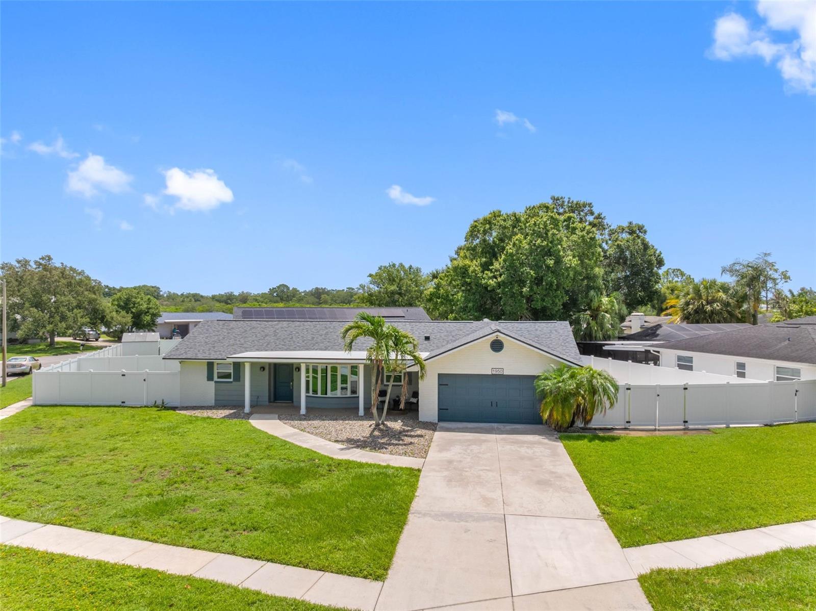 Welcome to 1950 Arvis Cir W, Clearwater, FL, a beautifully renovated 3-bedroom, 2-bathroom home offering 1,941 square feet of thoughtfully updated living space in one of Clearwater's most convenient locations. 
Major updates include a NEW roof, NEW HVAC system with ductwork, and new hurricane-impact windows, providing peace of mind for years to come. The combination of updated finishes and major system improvements makes this home truly move-in ready.
The heart of the home is the stunning, fully renovated kitchen featuring custom two-tone cabinetry, stainless steel appliances, a cooktop, double oven, generous pantry, and ample workspace for cooking and entertaining. The spacious living areas are filled with natural light, while the updated bathrooms offer clean, modern finishes. A versatile media or recreation room provides additional living space that can easily be used as a family room, game room, home office, or playroom.

Step outside to your fully fenced backyard, complete with a fire pit and plenty of space for entertaining, relaxing, or creating your own outdoor retreat.

Conveniently located just minutes from US-19, Gulf to Bay Blvd, St. Pete–Clearwater International Airport, Downtown Clearwater, Downtown Dunedin, and the award-winning Clearwater Beach, you'll enjoy easy access to shopping, dining, parks, entertainment, and everything the Tampa Bay area has to offer.

With extensive renovations, major mechanical updates, and an unbeatable central Clearwater location, 1950 Arvis Cir W is a fantastic opportunity to own a truly move-in-ready home.