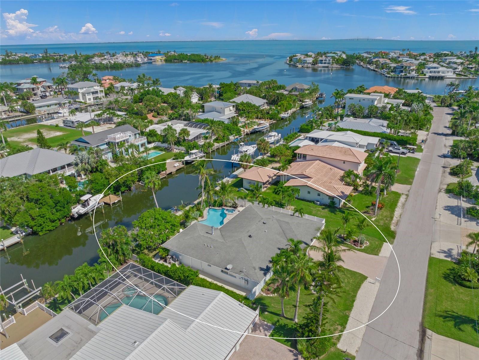 Tropical Waterfront Oasis in Holmes Beach!

Welcome to 518 74th Street, a stunningly remodeled coastal retreat that captures the essence of island living. This open-concept residence offers 3 spacious bedrooms, 3.5 luxurious baths, and is being sold designer furnished for a move-in ready experience.

Step inside to find a chef’s kitchen with high-end finishes, custom cabinetry, and generous counter space perfect for entertaining. Each bedroom features its own walk-in closet and private bath, blending comfort with elegance.

Outside, paradise awaits with 80 feet of deep sailboat-water frontage, a new seawall, and direct boating access to the Gulf. The backyard is a private tropical sanctuary, complete with a resort-style pool and spa surrounded by lush mature landscaping and fruit trees.

Just a short stroll to the beach, this home offers the perfect blend of luxury, relaxation, and convenience. Whether you’re seeking a full-time residence or a vacation escape, this tropical waterfront gem is ready to welcome you.