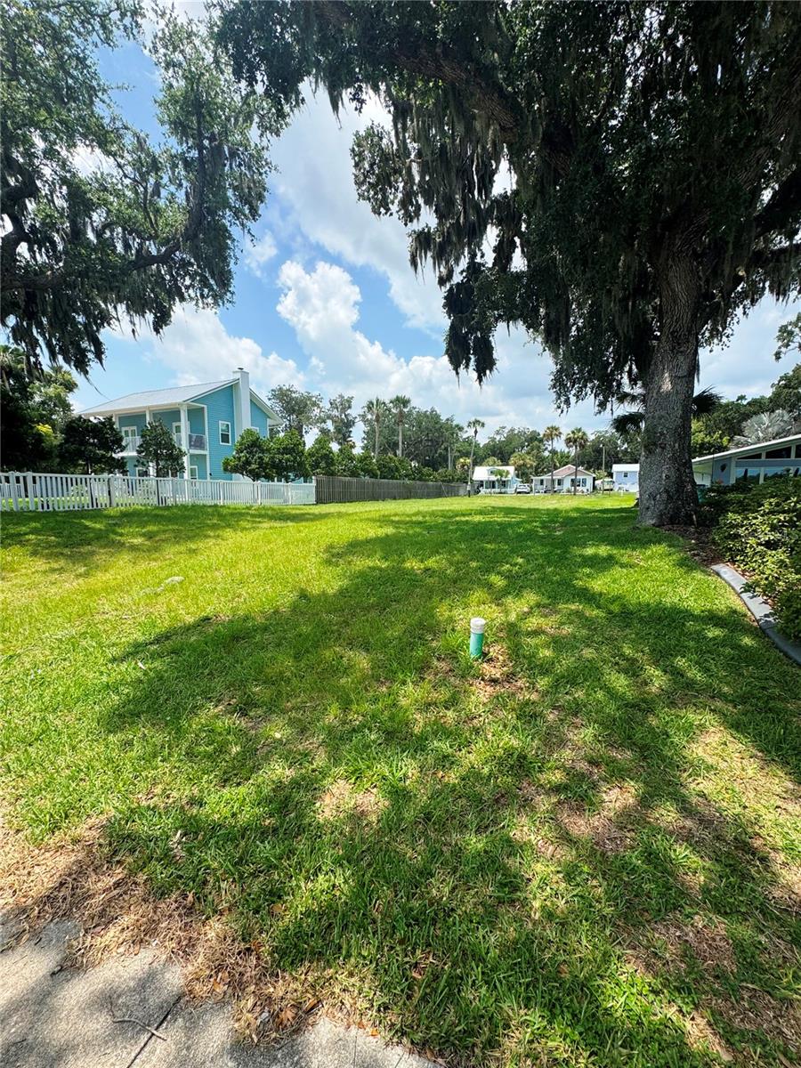 Located on the coveted North Riverside Drive, this riverfront vacant lot features a covered dock with deck and boat lift.   Lot has been fully cleared and is ready for your vision of Florida Living!  With being approximately 60 feet wide and 210 feet deep - there is plenty of room to build your waterfront dream home!  And spanning  between North Riverside Drive and Faulkner allows for numerous access and design options!  No HOA! The dock has both plumbing and electric.   In addition, there is an impact credit of approximately 3200 square feet available.  Numerous Canal Street area restaurants and shops are within walking-distance.  Flagler Avenue and the beautiful beaches of New Smyrna Beach are just a short golf cart ride to the east!