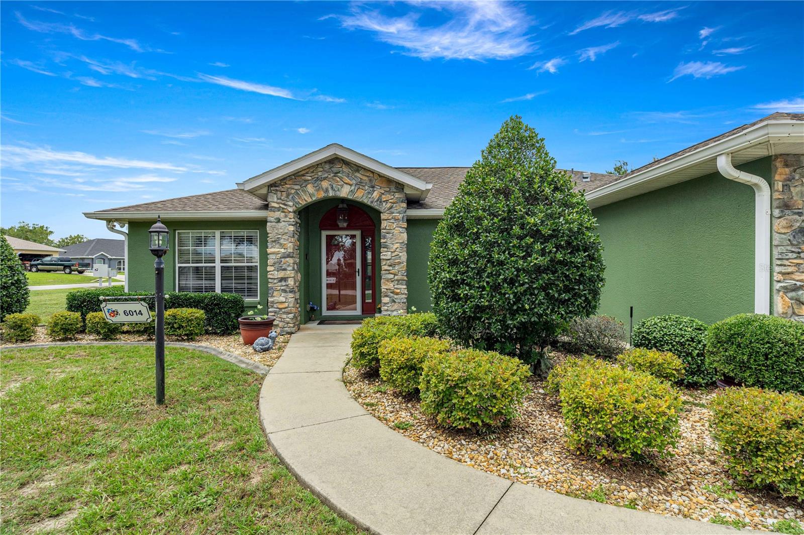 Welcome to your new chapter at Marion Landing – where worry-free living meets effortless style in an over-55 paradise. Tucked away on a quiet corner lot, this 3-bedroom, 2-bath, 2-car garage gem is move-in ready & waiting to impress. Step inside & feel the crisp, clean energy.No carpet anywhere – just gleaming surfaces and an open layout that welcomes you home. Soaring vaulted ceilings create an airy, spacious feel, while the separate dining room and cozy breakfast nook with a breakfast bar offer versatility for everything from holiday dinners to morning coffee. The kitchen is a chef’s delight with recently updated appliances and an abundance of cabinetry W/ pull-out slide-outs, a generous pantry, and extra storage that will make organization a breeze. You’ll never run out of room for your culinary treasures. Retreat to the master suite, your private sanctuary. The ensuite bathroom boasts tall countertops, a walk-in shower, and a luxurious jetted tub – perfect for unwinding after a long day. The walk-in closet is spacious enough for any wardrobe. The third bedroom features elegant double doors, making it ideal as a guest room, home office, or den – your choice. But the real showstopper? The enclosed Florida room – a bright, bug-free space to enjoy the sunshine year-round. Step outside to your own concrete patio, perfect for grilling, gardening, or simply soaking up the Florida breeze. Peace of mind is built in: a brand-new 2025 HVAC system & a 2021 roof mean you can move in with zero worries. And the LOW HOA is a dream come true – covering water, sewer, trash, plus access to a sparkling pool, an 8-lane bowling alley, shuffleboard courts, a fitness room, and more. Yes, bowling in your own community! Location? Flawless. You’re just minutes from shopping, medical centers, and all the amenities you need – yet this corner lot sits on a quiet street, offering tranquility and privacy. This is more than a home – it’s a lifestyle. Come see why Marion Landing is the over-55 community you’ve been searching for. Move-in ready and waiting for you to call it home. See the Interactive Virtual Tour! Ask about a $5000 concession at closing! or Call for your showing today!
