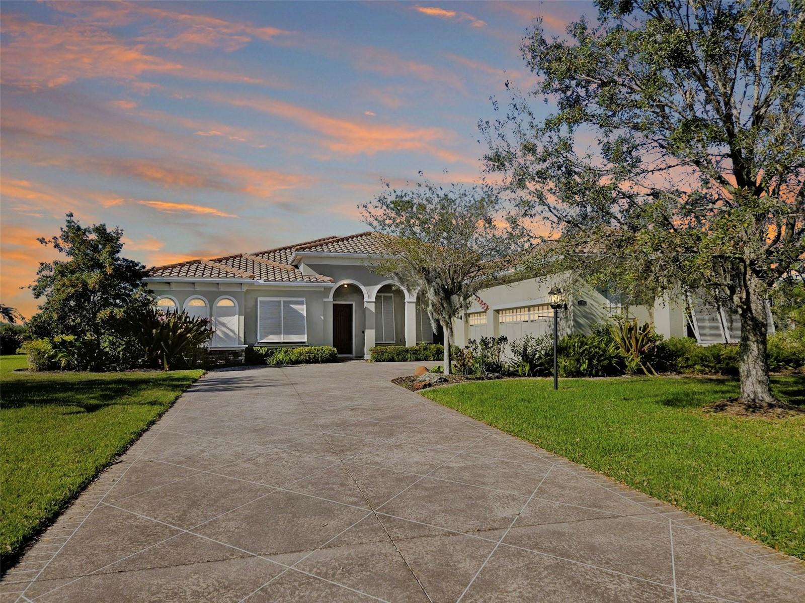 One or more photo(s) has been virtually staged. LUXURY,LAND & 24 ACRE LAKE VIEW THE ULTIMATE FLORIDA LIFESTYLE  
Exclusive 13-Home Community- A True Hidden Gem

Experience the pinnacle of Sarasota luxury living in this exceptional lakefront pool home estate set on over one plus private acre in the exclusive Regent Lake community.
Showcasing the highly desirable Osprey floor plan, this expansive residence with 3104 sq ft of living space offers 4-bedrooms, office /library 3-bath offers refined living with an oversized 3-car garage and a thoughtfully designed split floor plan ideal for both entertaining and everyday comfort.

From the moment you arrive, you are greeted with breathtaking panoramic views of a 25-acre spring-fed lake, delivering stunning sunsets and a peaceful, no-through-traffic setting that is truly rare to find.

Inside, elegance meets functionality with formal living and dining rooms, a spacious family room, and a gourmet kitchen designed to impress. Featuring stainless steel appliances, granite countertops, upgraded wood cabinetry, built in oven microwave combination, cooktop, custom wood vent hood, walk-in pantry, breakfast bar, center island, and a bright morning room — this kitchen is truly the heart of the home.

The luxurious primary suite is a private retreat, offering direct access to the pool and lanai along with serene lake views. The spa-style bath includes a garden tub, walk-in shower, dual vanities, and dual closets, including an oversized walk-in.

Step outside to your screened lanai and pool area where indoor and outdoor living blend seamlessly. Enjoy tranquil lakefront views, breathtaking sunsets, and a private fenced area perfect for pets.

Recent upgrades provide peace of mind and modern efficiency, including:
** Bahama hurricane shutters throughout
** New A/C (2025)
** New water heater (2025)
** Whole-house generator with buried 500-gallon propane tank
** Reinforced garage door (150 mph rated)
** Added attic insulation
** All Bedrooms have brand new Laminate flooring just installed last week

Regent Lake is an intimate community of just 13 homes, offering low HOA fees, no CDD, and a lifestyle centered around privacy and nature. The spring-fed lake is navigable by canoe or kayak, adding to the unique charm of this one-of-a-kind property.

Conveniently located near shopping and top-rated Tatum Ridge Elementary School, this home offers the perfect blend of luxury, location, and lifestyle.

This is more than a home — it’s a rare opportunity to own a private waterfront estate in one of Sarasota’s most exclusive settings.