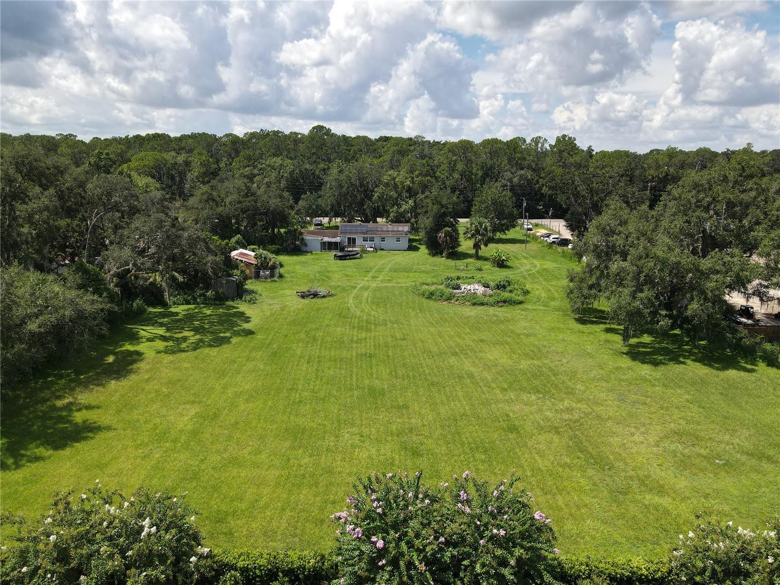 An Ideal Investment Piece in Osceola County. This 2-ACRE property currently features a small residential home but is ZONED COMMERCIAL Tourism (CT), offering a wide range of potential uses. Whether you’re looking to develop a commercial venture, hospitality project, or other tourism-driven business, this land provides flexibility and prime positioning for future growth. Located in a rapidly developing area with increasing demand, the possibilities are extensive.

The property sits directly on Orange Blossom Trail (SR 441), which is planned for a major expansion from two lanes to four lanes, projected between 2030 and 2040. This upcoming infrastructure improvement highlights the area’s continued growth and rising commercial potential. With the surrounding corridor already transitioning toward commercial use, this lot offers a strategic long-term investment opportunity.

Permitted uses include (but are not limited to): Hotels, bed & breakfasts, and campgrounds, Theme parks and entertainment complexes, Big-box retail and food/beverage sales, Daycare or adult care centers, Gas stations and auto leasing, Educational and medical facilities, Indoor gun range, gym/fitness center, and more.