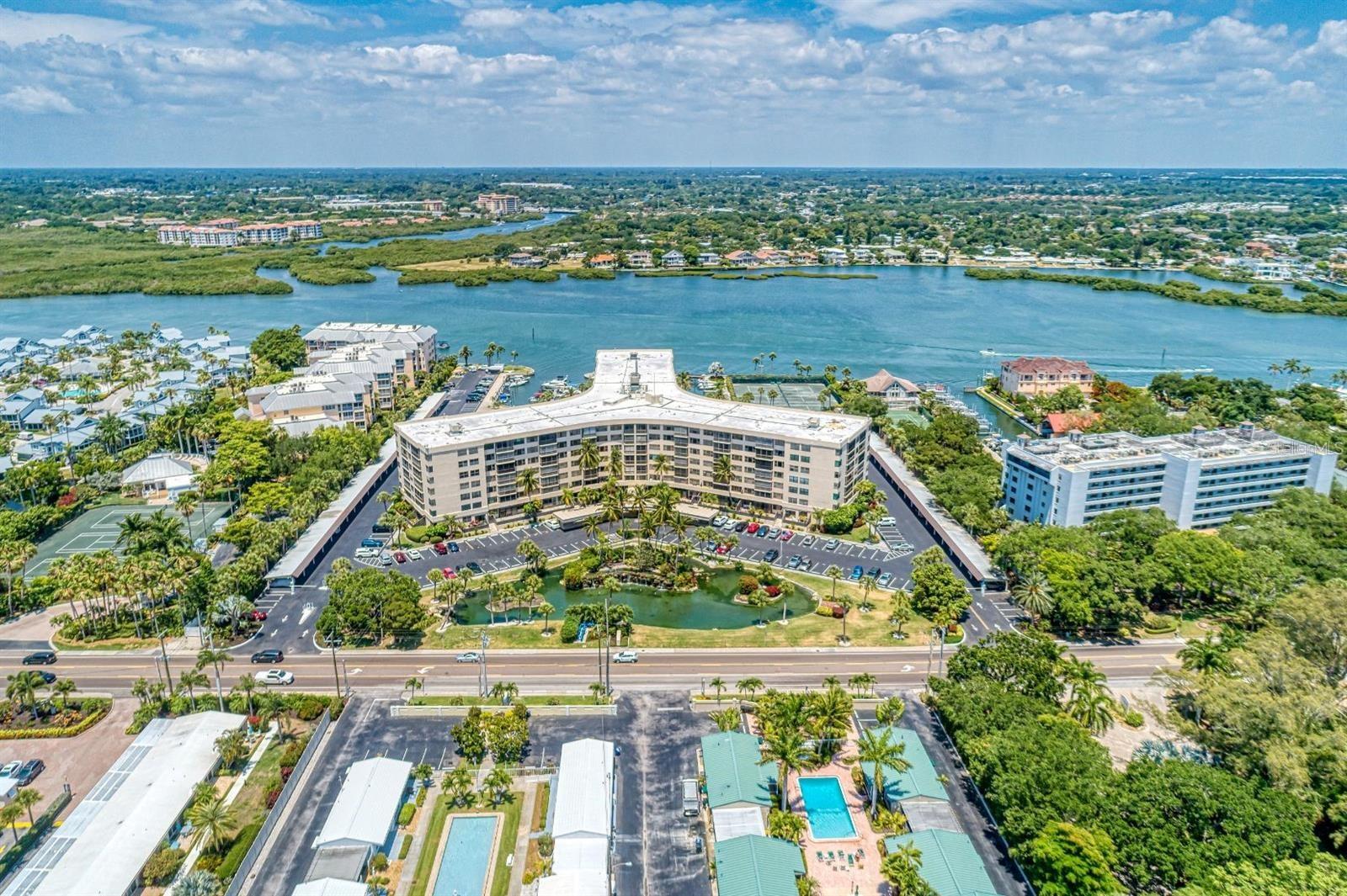 This beautifully updated sunrise-facing 1 BR, 1 bath home offers breathtaking views of the intracoastal waterway, a completely upgraded oasis to provide modern comfort and elegant coastal style with a gorgeous view of the heated pool and outdoor awning for alfresco dining. Rental is turnkey furnished, decorated for immediate enjoyment with all of the amenities you will need for a relaxing vacation. The stunningly renovated interior features hurricane-rated windows, a breathtaking quartz kitchen, vinyl plank wood floors and a stunning bathroom accented in gold. The open-concept living and dining area is filled with natural light, creating a bright and welcoming space ideal for relaxing or entertaining. Included is a washer and dryer, plenty of extra storage space directly across the hall and additional large washers and dryers located on each floor for larger items. Perfect for couples and extended stays, this retreat combines modern coastal finishes, large windows, and resort-style amenities just minutes from world-famous Siesta Key Beach and Siesta Key Village. For boating enthusiasts, you’ll find a beautiful marina with boat slips, as available, through the association as well as kayak storage. Two-week minimum renters enjoy an exceptional collection of amenities, including: *A large marina *Gulf access (no fixed bridges) *Heated swimming pool and shallow wading pool *Three tennis courts *Fully equipped fitness center with new showers and saunas *Clubhouse with social spaces and large kitchen •Outdoor BBQ and kitchen prep area under a beautiful new awning *For boating enthusiasts, boat slips are available through the association plus an ample kayak storage area.