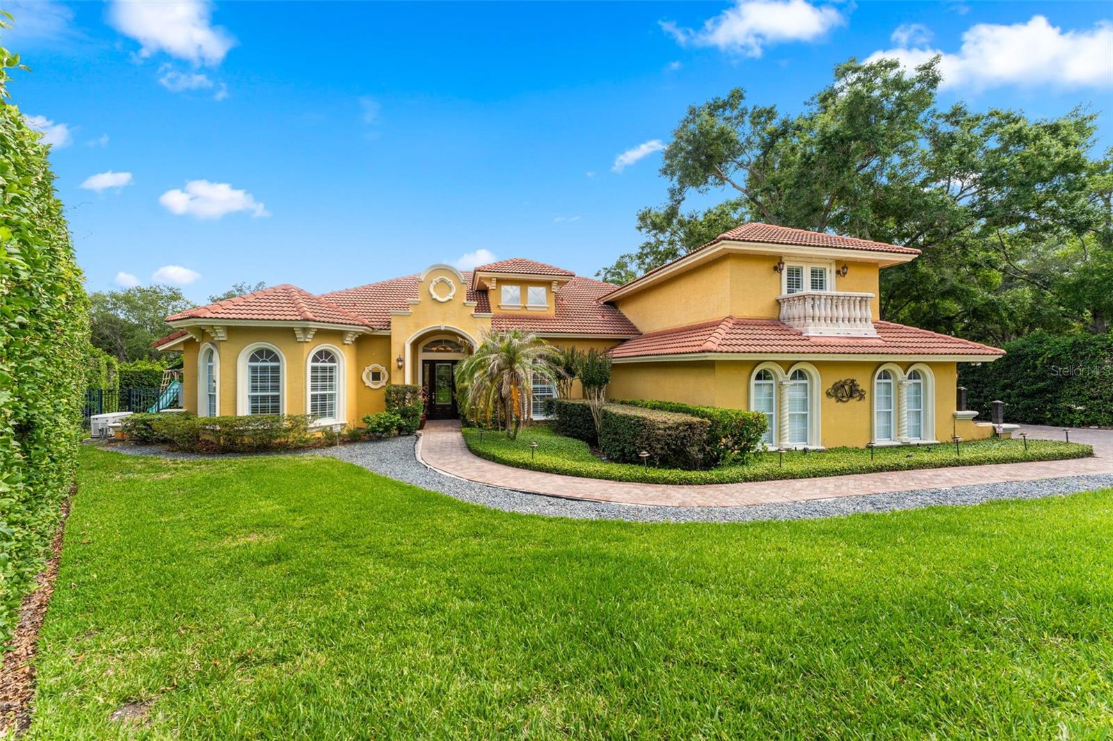 Tucked behind the gates of one of Longwood’s most desirable communities, this beautifully maintained four-bedroom, five-bath estate blends timeless elegance with modern luxury. From the moment you enter, soaring elevated ceilings, refined architectural details, and expansive living spaces create an immediate sense of sophistication and comfort.

Designed for both everyday living and exceptional entertaining, the home features a thoughtfully crafted floor plan, upscale finishes throughout, and a stunning chef’s kitchen appointed with high-end appliances, custom cabinetry, and generous gathering space at the heart of the home. Includes a whole house generator and security system.

The spacious primary suite offers a private retreat with spa-inspired amenities, while each additional bedroom provides comfort, privacy, and its own distinctive character. Multiple living and entertaining areas flow seamlessly to the outdoor oasis, where a sparkling pool and beautifully maintained surroundings invite year-round Florida living at its finest.

Set within a secure gated neighborhood in the heart of Longwood, this exceptional residence delivers luxury, privacy, and convenience in one extraordinary offering.