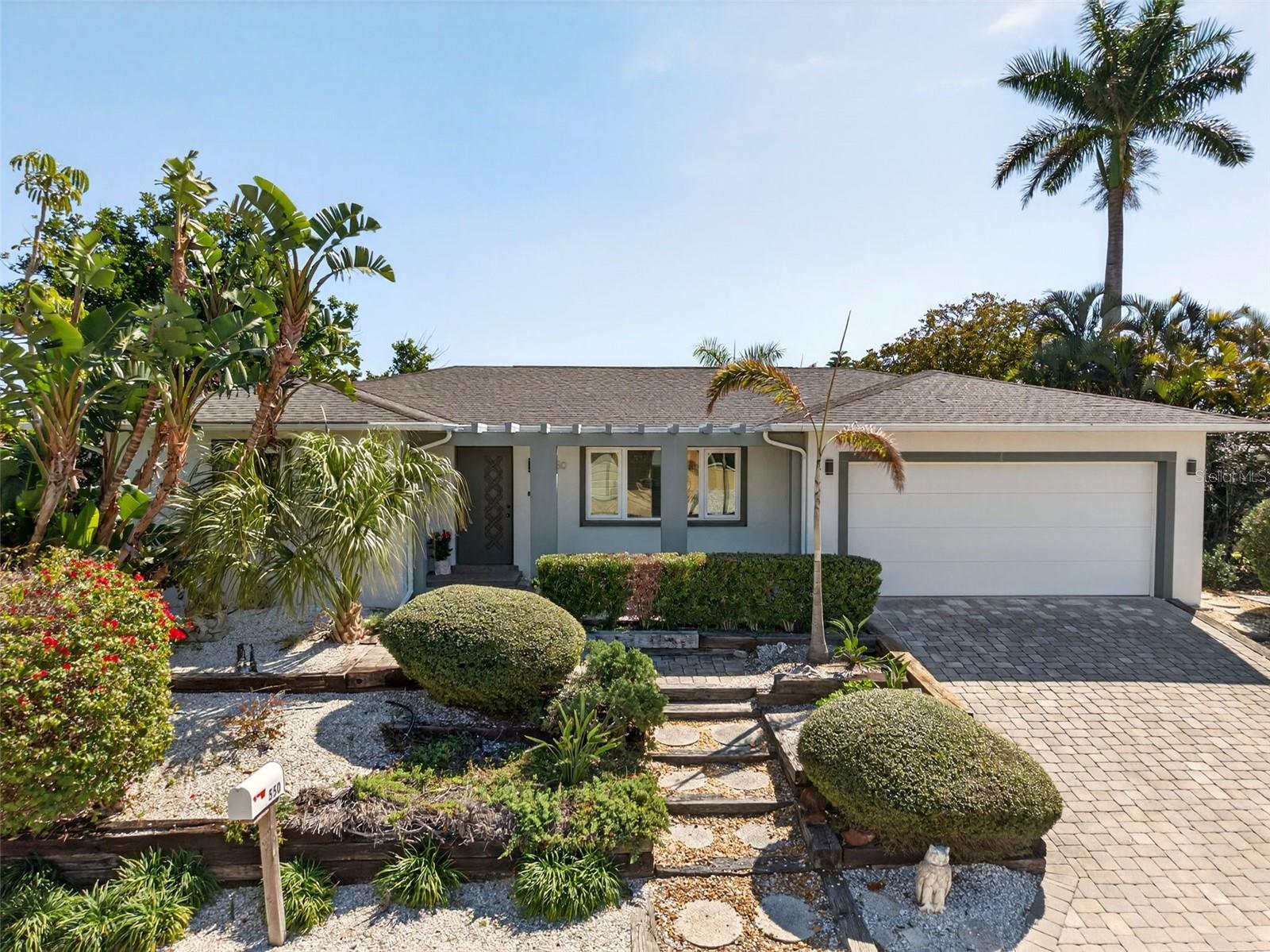 One or more photo(s) has been virtually staged. Welcome to 550 De Narvaez Drive, a meticulously maintained WATERFRONT residence set on an ELEVATED 10,000 sq. ft. lot in the highly desirable Sleepy Lagoon neighborhood on the NORTH END of Longboat Key. This solid concrete block home has experienced NO FLOODING & NO STORM DAMAGE, offering exceptional peace of mind. Spanning 1,758 sq. ft., the light-filled interior features 3 SPACIOUS BEDROOMS and 2 beautifully RENOVATED BATHS. Generous room sizes, abundant natural light, and an inviting floor plan create a true sense of warmth throughout the home. The UPDATED KITCHEN and baths showcase contemporary finishes while maintaining comfort and functionality. Enjoy peaceful CANAL VIEWS with direct access to Sarasota Bay—perfect for boating enthusiasts and embracing the ultimate Florida waterfront lifestyle. NEW DOUBLE PANE IMPACT-RESISTANT WINDOWS and sliding glass doors provide enhanced protection and energy efficiency. Additional upgrades include NEWLY LINED PLUMBING PIPES and UPGRADED ATTIC INSULATION for lasting durability and comfort. Offered FULLY FURNISHED, all furnishings convey with the sale—making this a true TURNKEY opportunity. Simply bring your suitcase and start enjoying coastal living immediately. The expansive elevated lot offers ample space for outdoor entertaining, gardening, or FUTURE EXPANSION POTENTIAL. Ideally located near world-renown Gulf beaches with BEACH ACCESS, exclusive dining, boutique shopping, and recreational amenities, this exceptional property is well-suited as a primary residence, seasonal retreat, or investment opportunity. Schedule your private showing today and experience refined, worry-free waterfront living at its finest.
