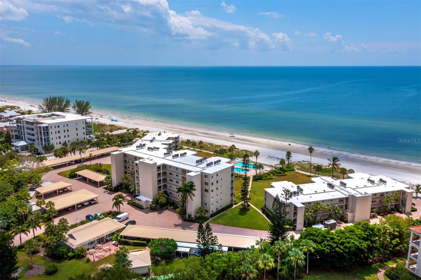 Experience the epitome of Island living in this meticulously kept and beautifully renovated retreat located in the beachfront community of The Westchester on Longboat Key. This ground floor walk-out, 2 bedroom, 2 bath residence is a true coastal oasis all done up in seaside hues. The gorgeous kitchen opens to the large living/dining area and the spectacular views can be seen through impact resistant sliding doors that open wide for easy indoor/outdoor living. Step out to one of two private screened in lanais and you'll find the perfect spot to enjoy a morning coffee or an evening beverage while watching the sunset. This home is being offered with all the designer furnishings, so all you’ll need to do is bring your flip flops. Here you will find a remarkable quality of laid back island life with the gorgeous beach that stretches for miles, 2 sparkling pools, a tennis and pickleball court, a shuffleboard court, and a lovely clubhouse. An on site manager is available Monday through Friday. If you're ready for more, fine dining and nightlife in the world famous St. Armands Circle and the cultural mecca of downtown Sarasota are just a short drive away. Important to note: The pool area is currently undergoing a transforamtion and will include a new spa, a tiki hut and new landscaping when complete. Also important: The Westchester has completed its Milestone Inspection and all assessments have been paid in full.