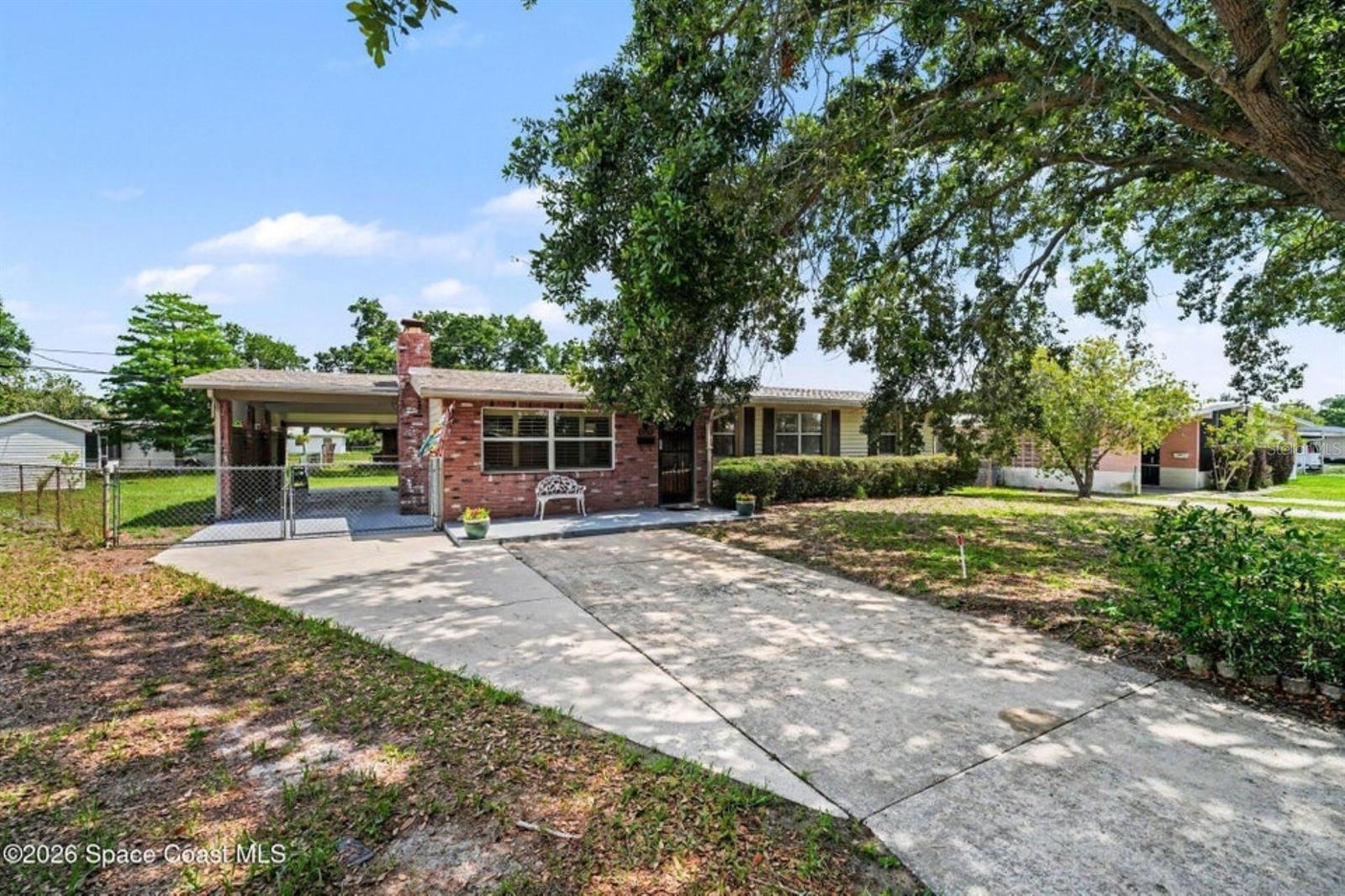 This charming well-maintained home has 2 bedrooms, 1 bath with carport. With a freshly painted interior, this cozy home is move in ready. Step inside to a welcoming living room highlighted by a beautiful stone accent wall with fireplace. The updated bathroom features new vanity, lighting, sink, faucets & valves. The kitchen has new refrigerator, lots of cabinets, counter space & breakfast bar. Sliding door off of kitchen leads to the covered patio with swing. Great for entertaining. The spacious laundry room offers storage & comes with washer & dryer & additional shower which is perfect for cleaning up after outdoor activities. The shed provides extra storage as well. Additional features include a convenient carport. Roof replaced in 2024, AC 2014. Whether you're looking for a starter home, downsizing or seeking an investment opportunity, this is the perfect property. Home comes furnished. Located close to EFSC, schools, restaurants & major road roadways.