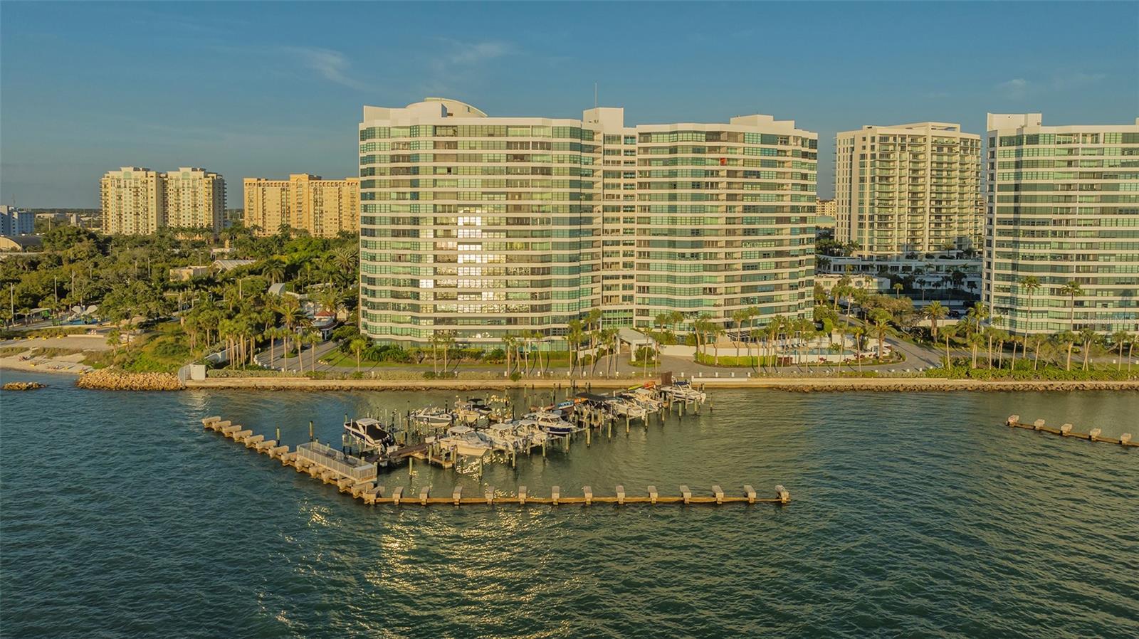One or more photo(s) has been virtually staged. (To show this unit’s full potential) The Bayfront Horizon is Your  Neighbor -  Imagine a lifestyle where the sunset never has an expiration date. This isn't just a beautiful condo; it’s a front-row seat to the best of Sarasota. Perched in the iconic Condo on the Bay, this fully renovated 2-bed/2-bath sanctuary offers "forever" views of the Bayfront, Longboat Key, and the Ringling Bridge—views protected by the water, with no future buildings to ever obstruct your peace. The Interior Experience:  Step into a Great Room where the boundaries between indoors and out vanish. A massive wall of impact-glass sliders pulls the turquoise waters right into your living space. Underfoot, White Oak engineered hardwoods lead you past a custom dry bar—complete with a wine fridge—toward a kitchen designed for the culinary artist. Featuring Elite Woodwork of Sarasota cabinetry, a Walnut backsplash, and an induction cooktop, this space is as functional as it is beautiful. Your Private Oasis:  The master suite is a masterclass in serenity. Wake up to calm water views, adjust your environment with remote-controlled Hunter Douglas shades, and prepare for the day in a spa-inspired en-suite featuring dual floating vanities and a multi-head rainfall shower. Even the secondary bedroom is generously scaled, ensuring guests feel the same level of coastal luxury. The Lifestyle & Amenities: Living here means the best of Sarasota is at your doorstep. Whether you’re launching a kayak from the private docks, playing a match on the lighted pickleball or tennis courts, or socializing at the resort-style pools, the "Tower II" lifestyle is one of effortless sophistication. Peace of Mind: 24-hour gated security, concierge services, and a newer HVAC (March 2023). The Location: A short stroll to the vibrant arts of Downtown Sarasota and a quick hop to the sands of Lido Beach. Ready to live where the city meets the Bay? Welcome home to Condo on the Bay, Tower II  #311.
