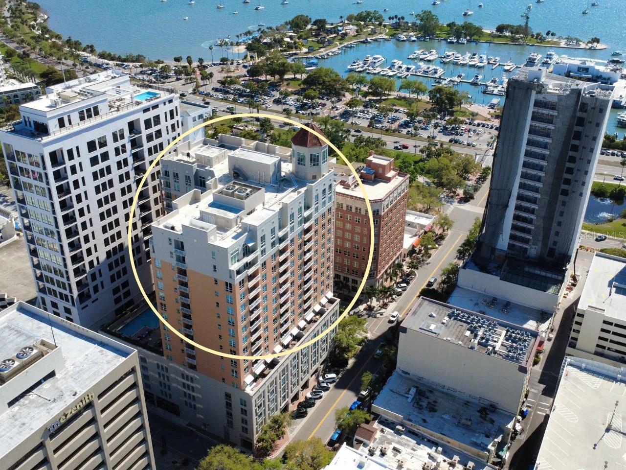 Located at the direct epicenter of downtown Sarasota on Main Street, this 5th-floor residence at 1350 Main Street offers the ultimate turn-key downtown Sarasota condo for sale under $500k. Offering a rare sense of privacy with only three units on the entire floor, this 705 SF layout is perfect for a Florida seasonal retreat, a weekend getaway, or an effortless "lock-and-leave" lifestyle. Expansive North-facing windows flood the interior with natural light, while sliding glass doors open to invite in the city breeze. Motorized sun and blackout shades controlled by a hidden, customizable Lutron shade and lighting system provide quick control over the home’s light and atmosphere. A stackable washer and dryer are in the bathroom closet.

The efficient kitchen has a newer refrigerator and a KitchenAid range and dishwasher, opening into a spacious living area. In the primary suite, custom built-in shelving provides an elegant storage solution, and for those seeking an absolute move-in ready condo in Sarasota, the furnishings are negotiable (excluding the display cabinet). This pet-friendly condo in downtown Sarasota serves as a premier secondary sanctuary for those desiring a refined city escape.

Ownership includes the "gold standard" of luxury condo amenities and conveniences: a deeded parking space in the private garage and a highly coveted same-floor condo storage unit. Known for its 24/7 concierge service and meticulous cleanliness, the building offers resort-style amenities including a heated lap pool and spa, fitness center, catering kitchen, BBQ grill, social room, fire pit, library, and stylish clubroom.

Step out of the lobby and into the heart of walkable downtown Sarasota. Directly across Main Street, enjoy immediate proximity to local favorites including Clasico, Cafe Epicure, Selva, OfKors Bakery, Green Zebra, Cafe Amici, and Main Street Creamery. Explore the nearby galleries of Palm Avenue Sarasota, or take a scenic stroll down to Marina Jack and the beautiful paths of Bayfront Park. With the Sarasota Opera House, Florida Studio Theatre, Art Ovation, and local theaters just steps away, this is a rare opportunity to own Sarasota luxury real estate at the intersection of culture and convenience.