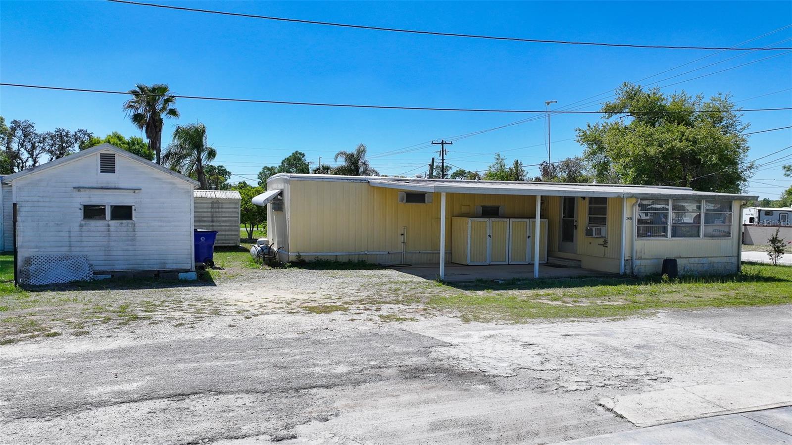 Welcome to this furnished 2 bedroom, 2 bathroom home on owned land near Lake Letta in Avon Park, Florida, an affordable opportunity with no HOA, no lot rent, and no special district fees. This move-in ready property offers flexible living with a finished enclosed porch perfect for a home office, bonus room, or additional living space. Inside, you’ll find vinyl plank flooring in the main areas, a gas stove, and washer and dryer hookup conveniently located inside the home. The property includes a covered carport, a shed, 120-gallon propane tank, septic system, and central water, and the owner states the current water bill is around $20.00 a month. A well is also present on the property, offering potential for irrigation, gardening, or sprinkler use. Cooling is provided by wall units, and gas heat adds efficiency during cooler months, with electricity serviced by Duke Energy. Located just minutes from multiple lakes, golf courses, medical facilities, restaurants, and shopping, this home offers the perfect balance of quiet Florida living with convenience. Enjoy easy access to Sebring, Avon Park, Lake Placid, Tampa, Orlando. Both Florida coasts, all within approximately two hours. Ideal for full-time living, seasonal use, or investment property.