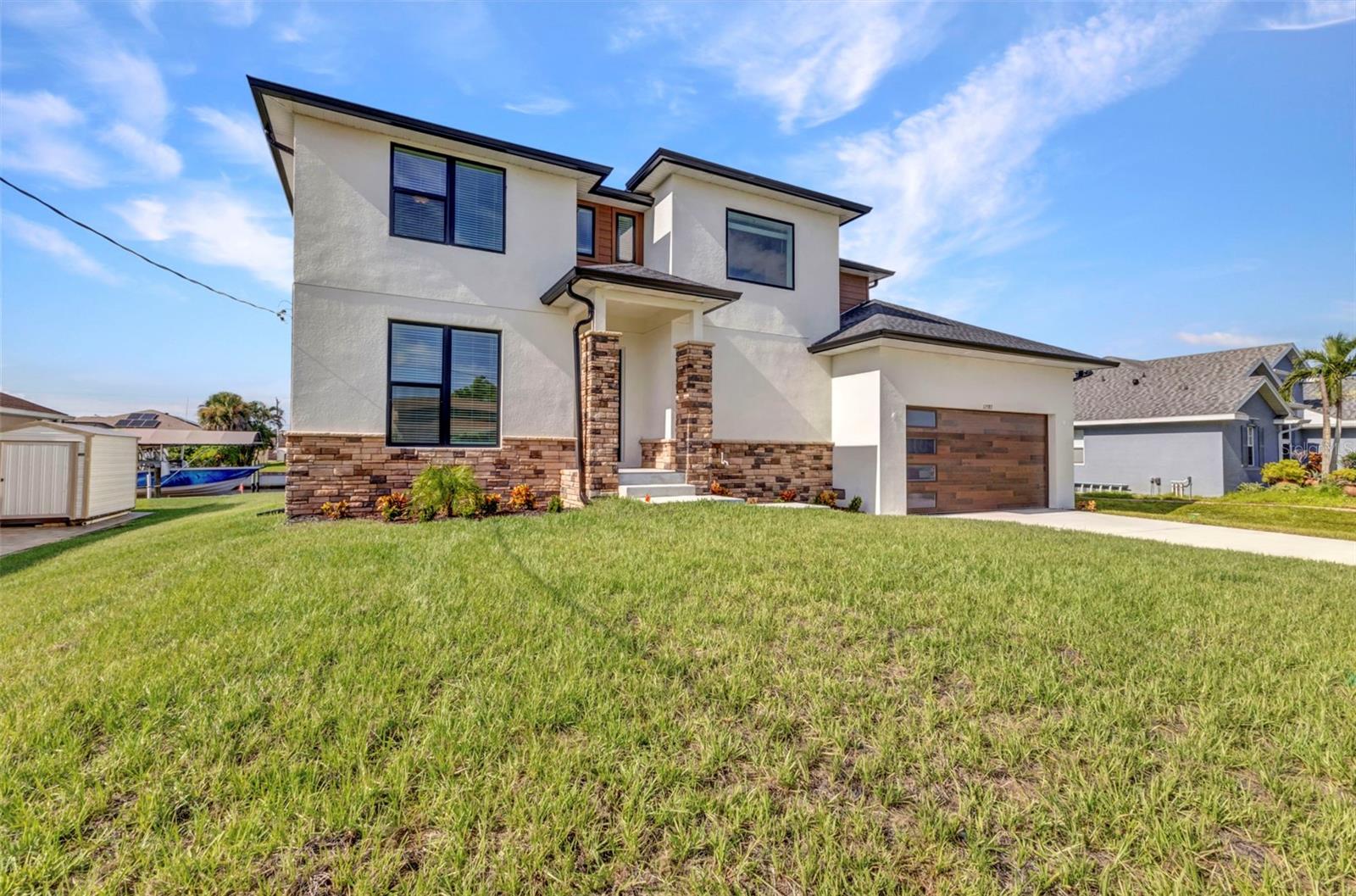 One or more photo(s) has been virtually staged. Under Construction but almost completed. RARE BRAND NEW WATERFRONT CUSTOM HOME IS A BOATERS DREAM! One of a kind CUSTOM BUILT, BRAND NEW waterfront home with 73 feet on the waterway with only 1 bridge to GULF ACCESS with MILLION DOLLAR WATER VIEWS! **$20,000 SELLER INCENTIVE** USE TOWARDS RATE BUY DOWN, CLOSING COSTS OR CASH DISCOUNT! MOVE IN READY NOW! **MAKE AN OFFER TODAY**This home is boasting 4 bedrooms, 2nd floor patio, a flex room which could be an additional bedroom and 3 full bathrooms, perfect for families, those looking for extra space or even as an investment such as renting the home as an AIRBNB OR VRBO. LARGE LAUNDRY ROOM WITH EXTRA STORAGE SPACE. HUGE OVERSIZED GARAGE can accommodate multiple vehicles! This home is ONLY 11 MILES to Englewood Beach! Enjoy waterfront living with direct access to the Myakka river and a PRIVATE BOAT DOCK right in your backyard. There is PUBLIC WATER and septic at this property. Inside you will find a split floor plan that offers both comfort and privacy. The huge great room is open to the kitchen and dinette area. Your fully equipped kitchen features a large ISLAND with QUARTZ COUNTERTOPS, shaker style cabinets including 42" upper cabinets, FRIGIDAIRE range, refrigerator, microwave and dishwasher included! The primary owner's suite is on the first floor and includes an ensuite bathroom and large walk in closet. The first floor also has a dedicated "flex room" which can be an office, exercise room or additional bedroom. Head upstairs to the GAME ROOM and additional bedrooms + full bathroom. With its spacious layout and modern amenities, this house is perfect for entertaining friends and family or simply enjoying a quiet evening at home. Enjoy Florida living the way it is meant to be with a large backyard patio near the water's edge. PLENTY OF ROOM FOR A POOL! Spend your days exploring the Gulf beaches which are just miles away. Don't miss out on this rare opportunity to own a beautiful BRAND NEW waterfront property in a growing a popular North Port location. Schedule a showing today and make this house your new home sweet home! MOVE IN READY NOW! MAKE AN OFFER TODAY!